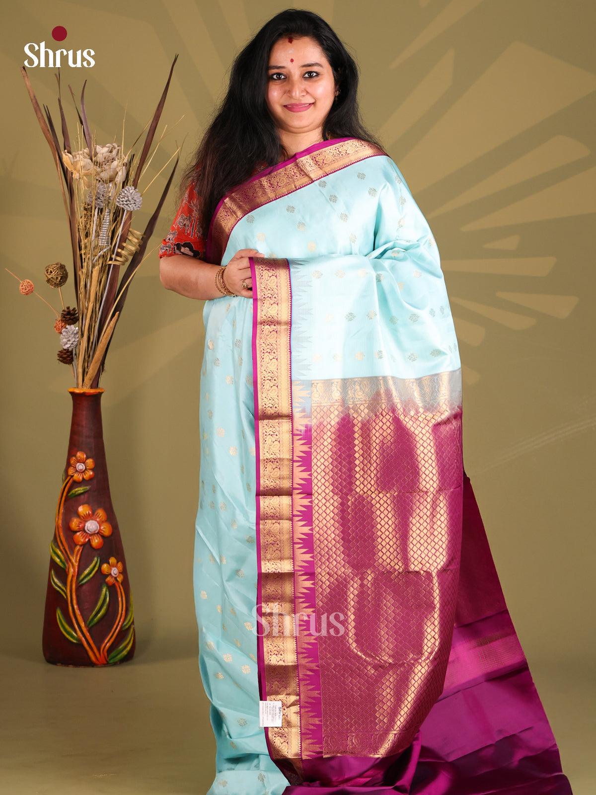 Pastel Blue Kanchipuram silk Saree gleams with gold zari floral buttas-1