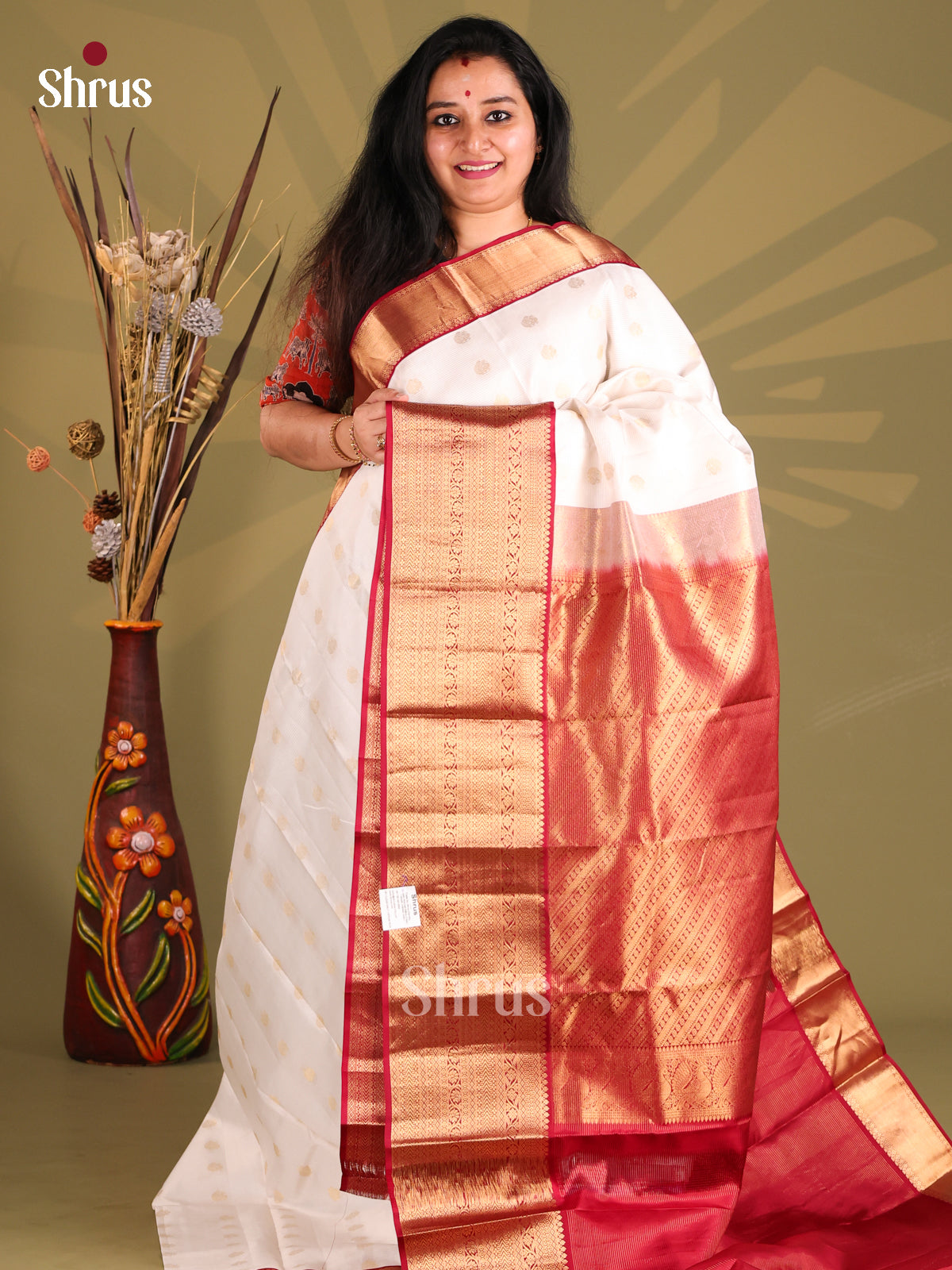 Gorgeous White Kanchipuram silk Saree with gold zari floralbuttas , rich border-1