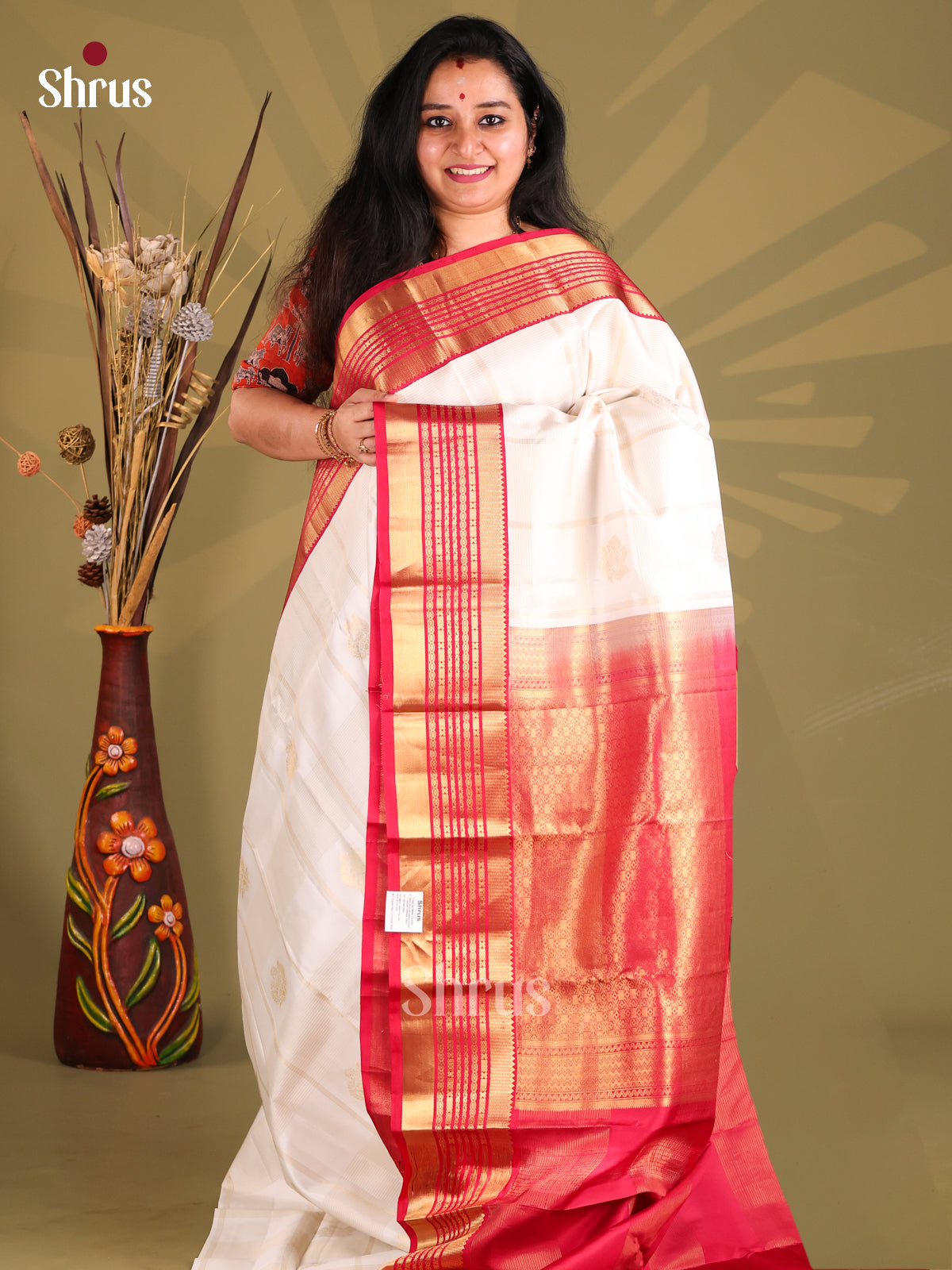 Enchanting White Kanchipuram silk Saree with zari stripes , floral buttas-1
