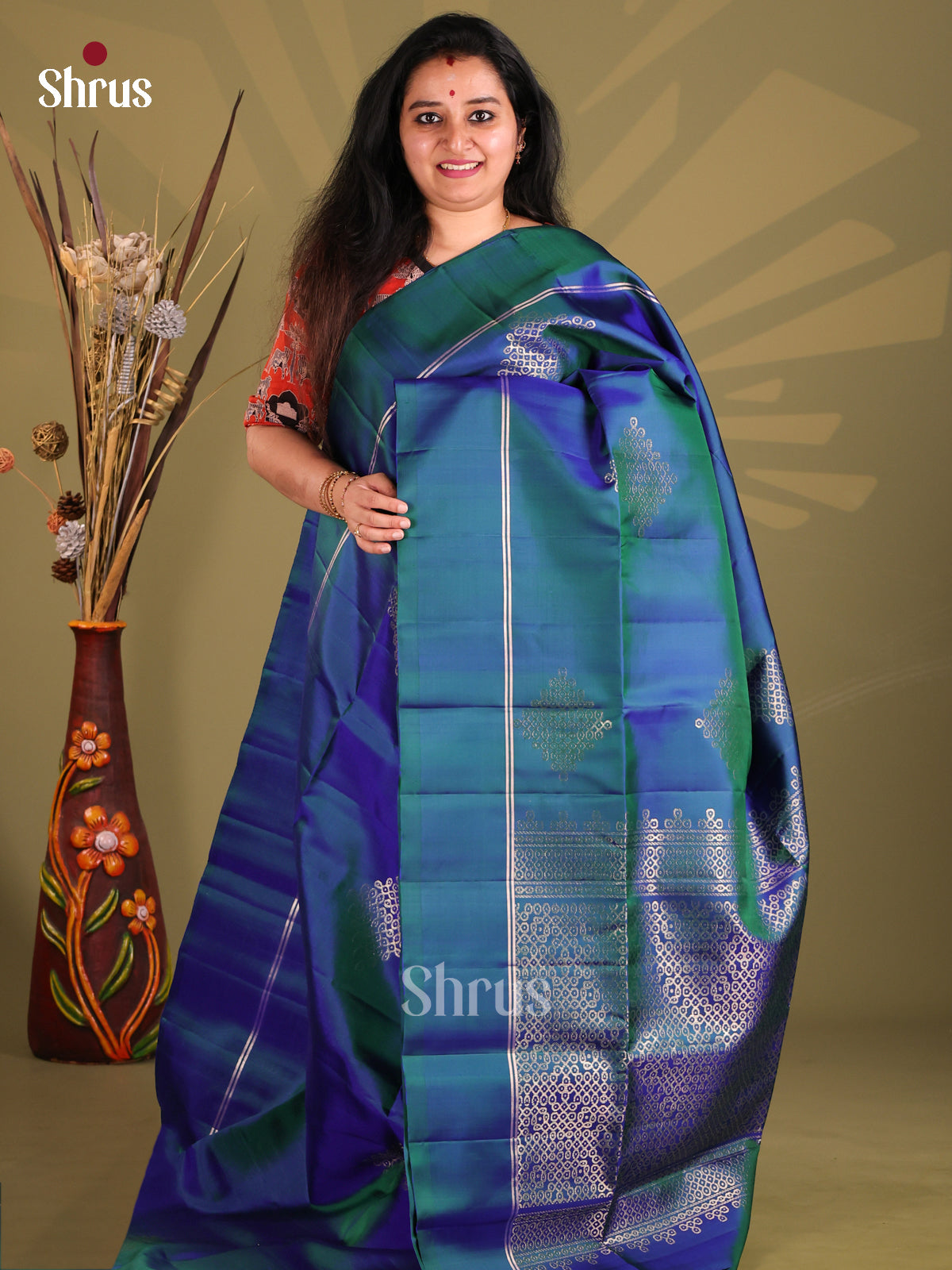 Peacock Blue Soft Silk Saree with gold zari kolam motifs