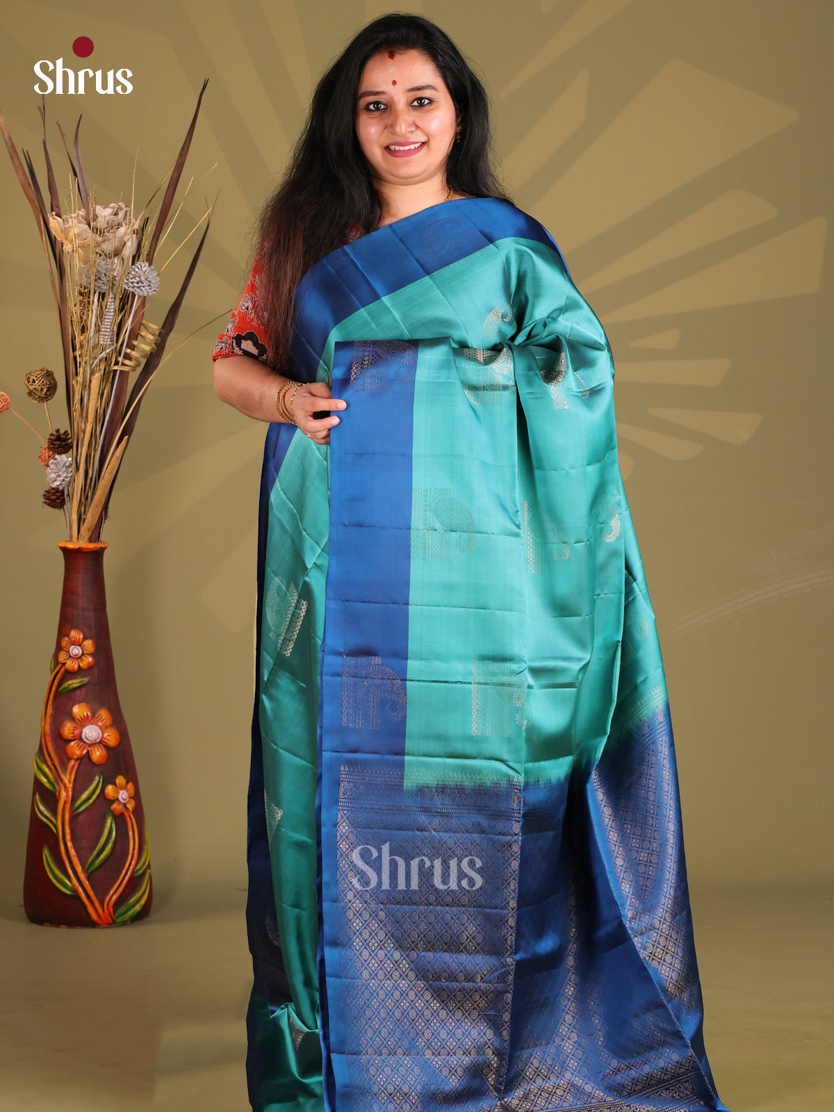 Vibrant Teal Soft silk-halfpure Saree with zari buttas
