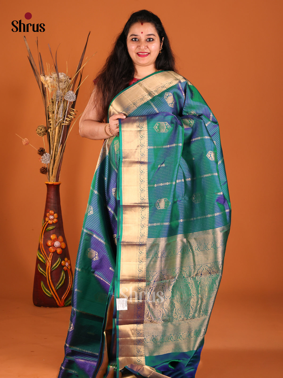 Beautiful Peacock Blue Kanchipuram silk Saree with vaitra oosi zari stripes , floral motifs-1