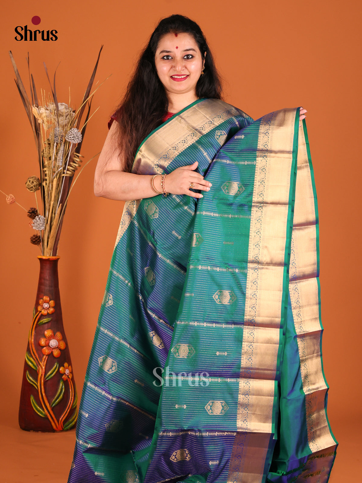 Beautiful Peacock Blue Kanchipuram silk Saree with vaitra oosi zari stripes , floral motifs-2