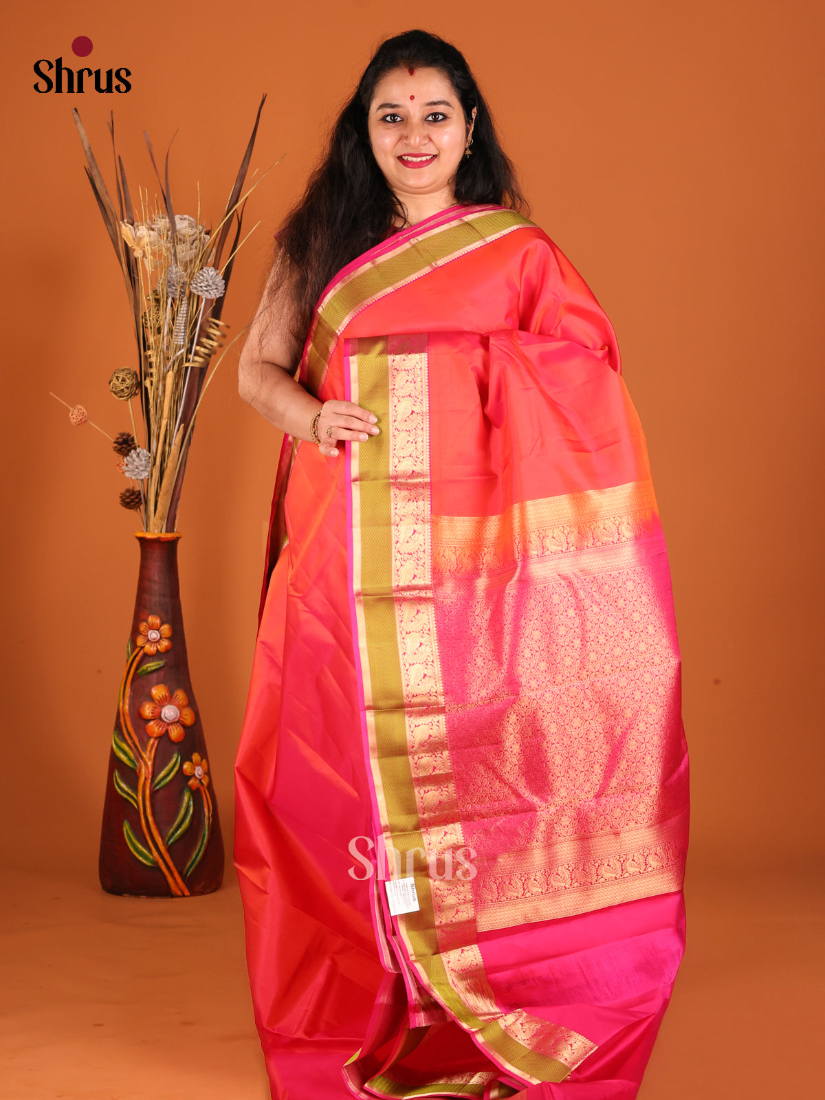 Radiant Orange Kanchipuram silk Sareewith contrast Peacock Vine Border-1
