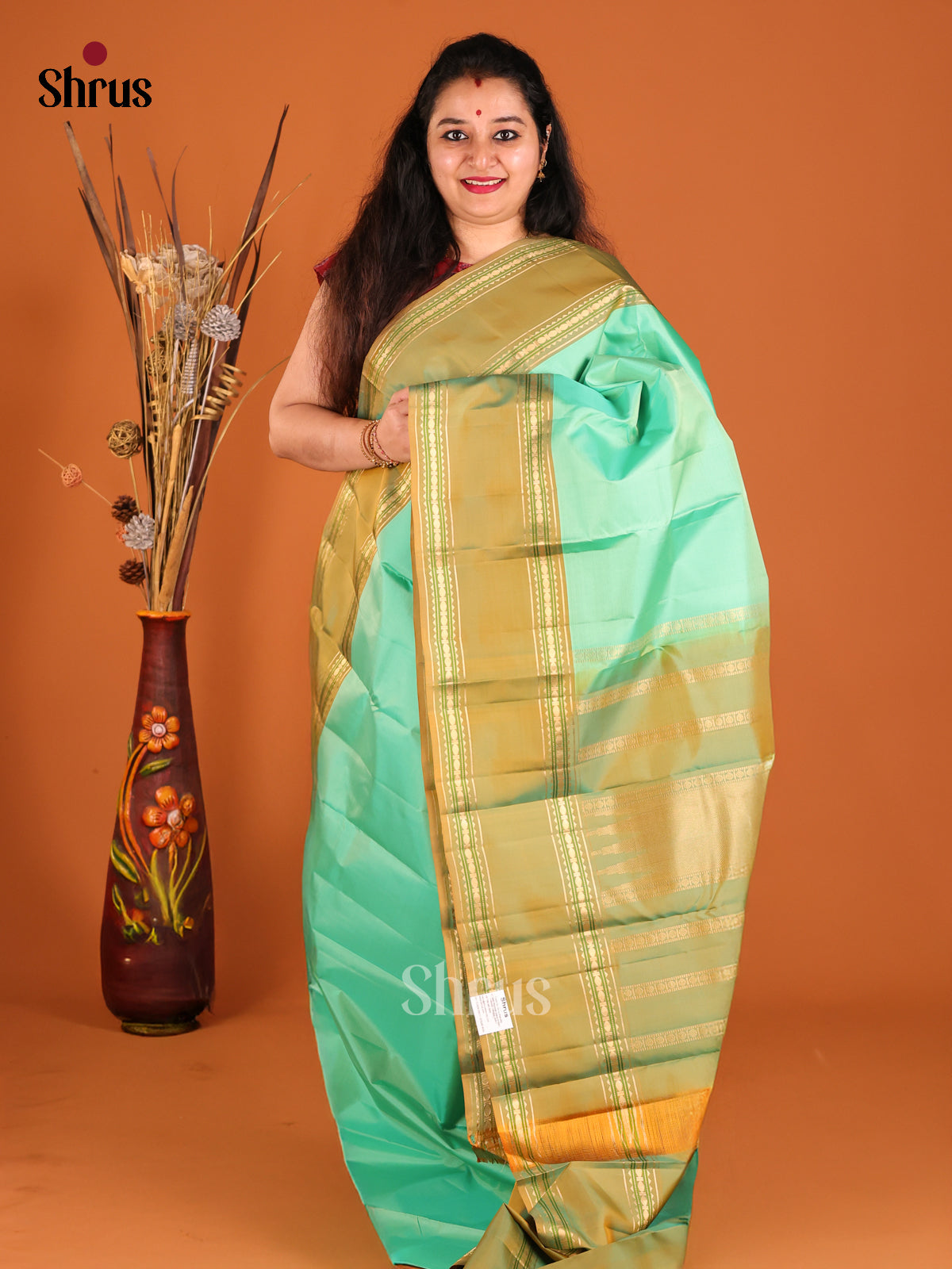 Pista Green Kanchipuram silk Saree with contrast rettaipet border-1