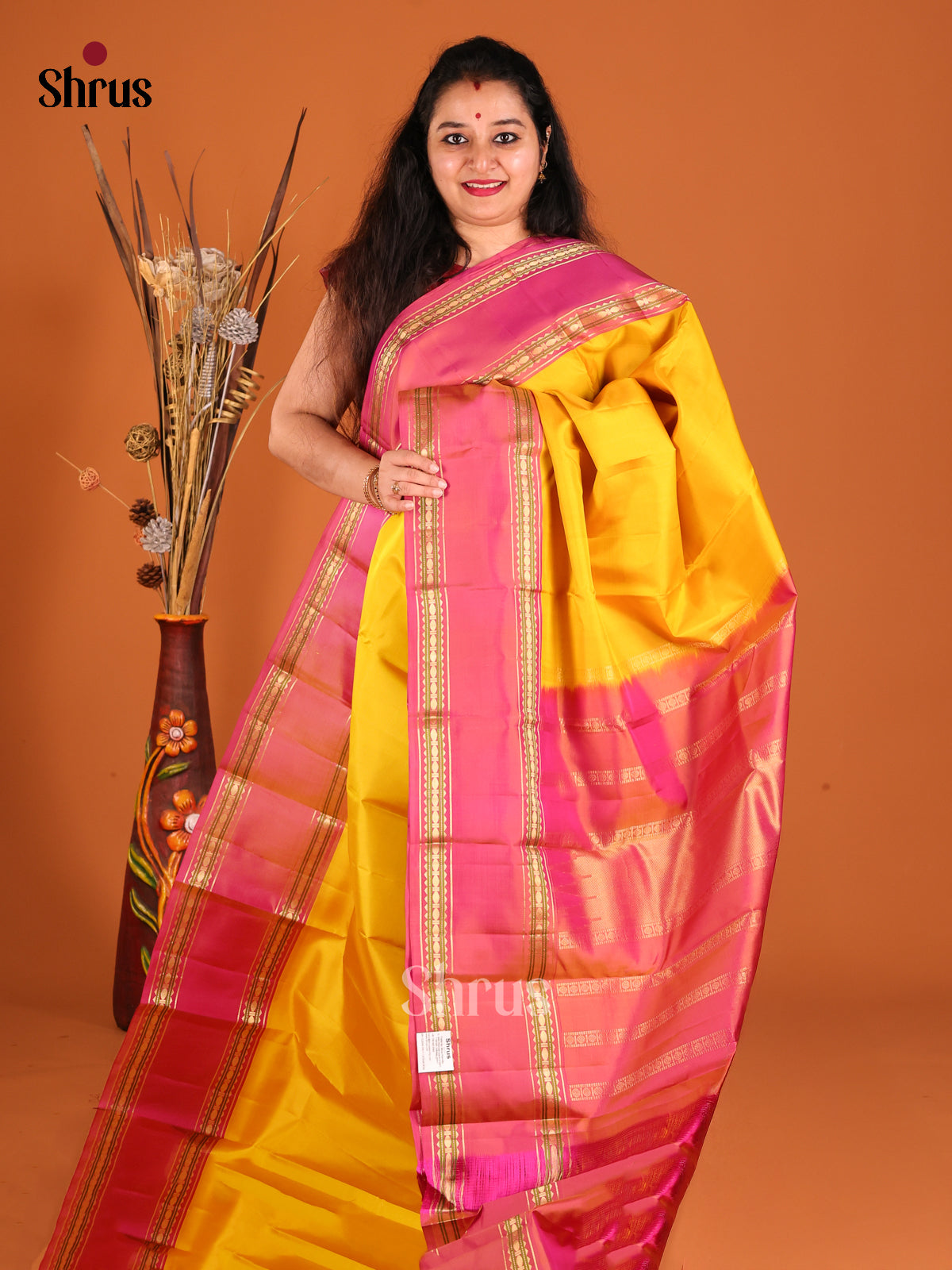 Glorious Yellow Kanchipuram silk Saree with contrast rettaipet border