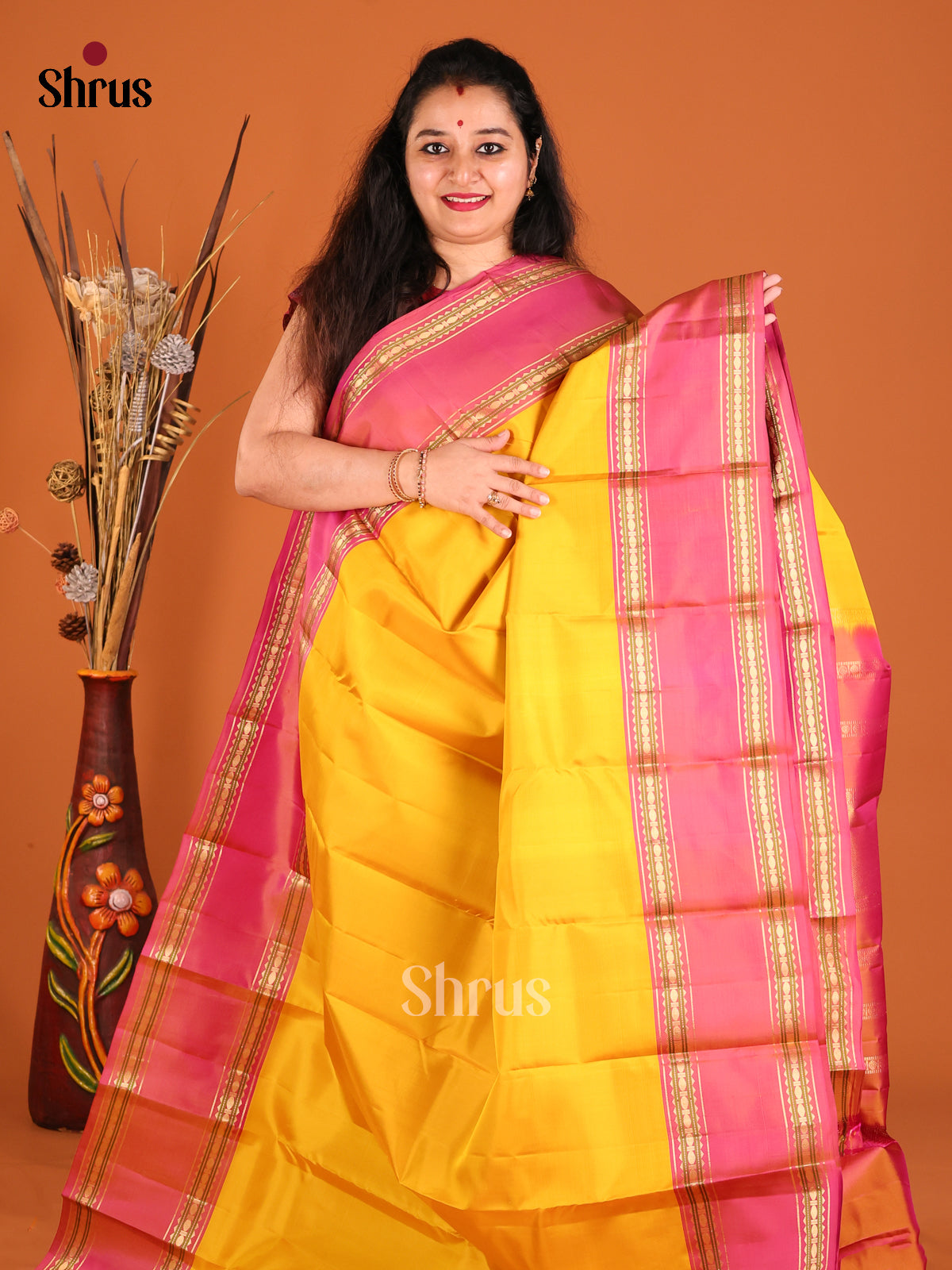 Glorious Yellow Kanchipuram silk Saree with contrast rettaipet border
