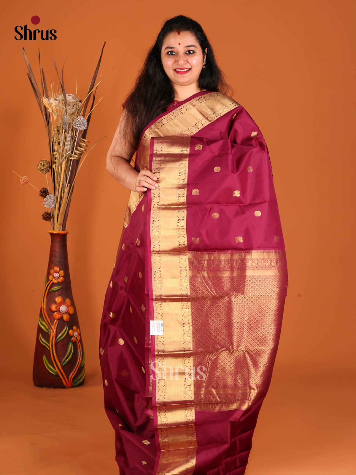 Classy Maroon Single Tone Kanchipuram silk Saree with peacock, floral buttas