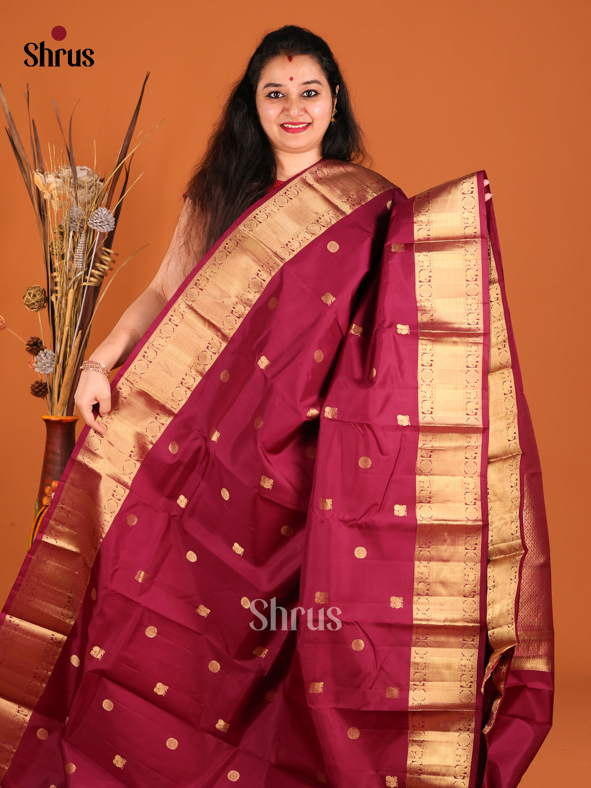 Classy Maroon Single Tone Kanchipuram silk Saree with peacock, floral buttas