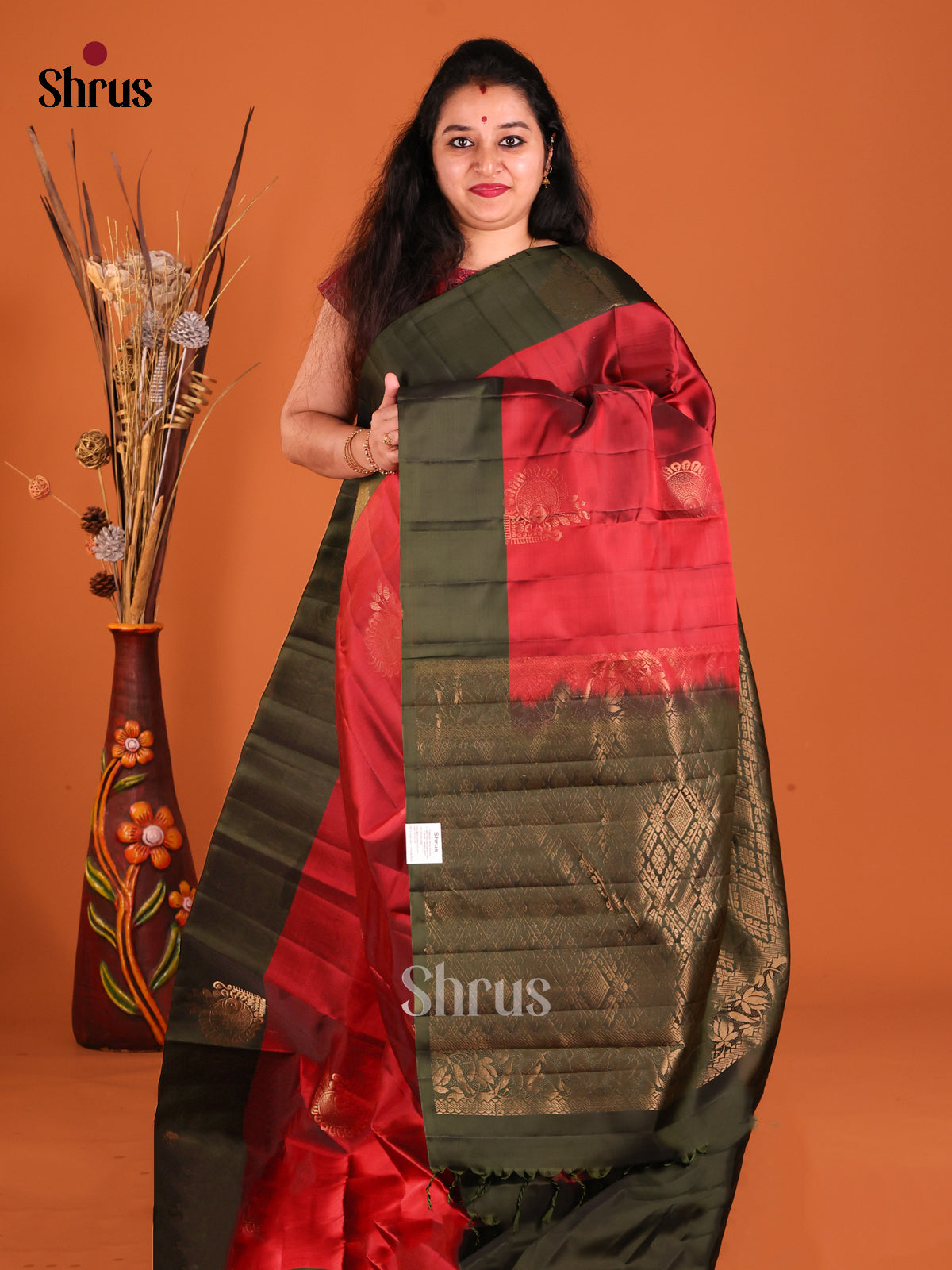 Red & Green Softsilk-halfpure Saree gleams with zari floral motifs