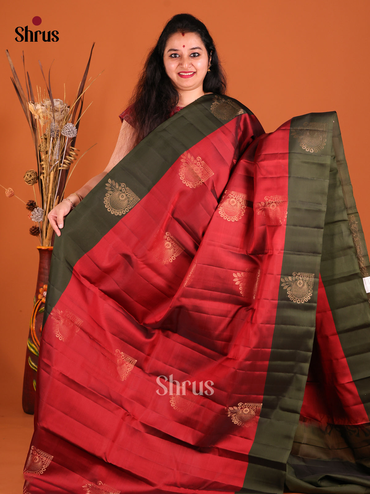 Red & Green Softsilk-halfpure Saree gleams with zari floral motifs