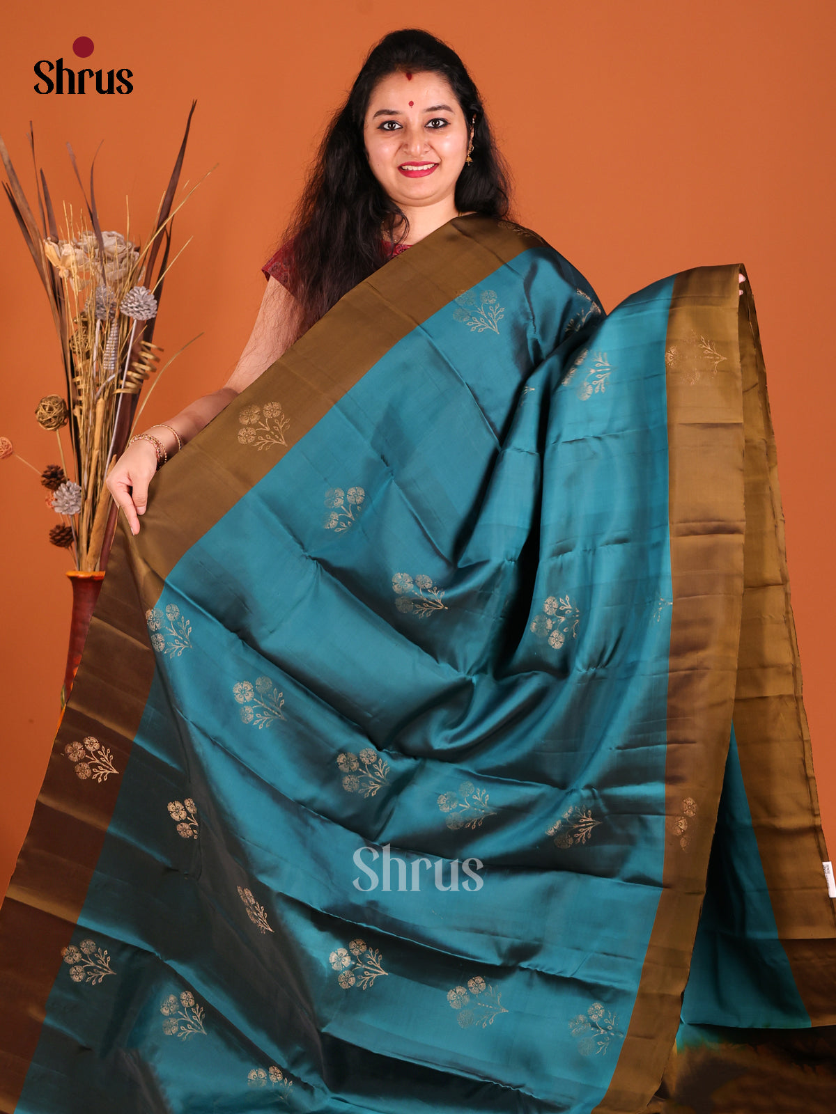 Blue & Chutney green Softsilk-halfpure Saree dazzles with zari floral buttas