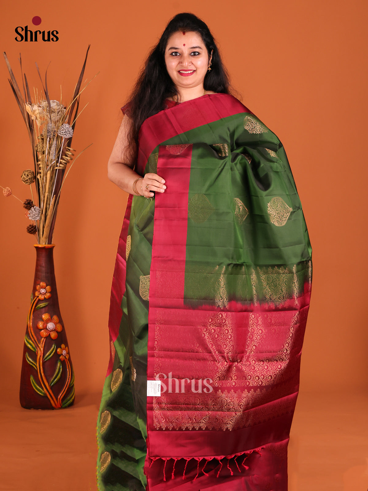 Green & Maroon Softsilk-halfpure Saree with gold zari floral motifs