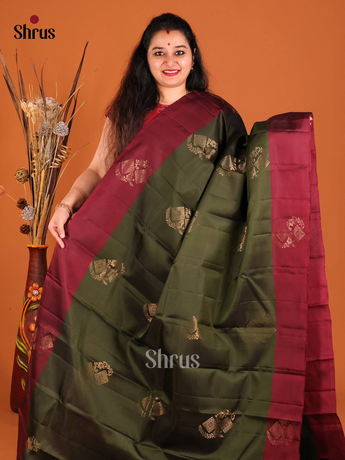 Green & Maroon Softsilk-halfpure Saree gleams with gold zari floral motifs - Shop on Shrus.com