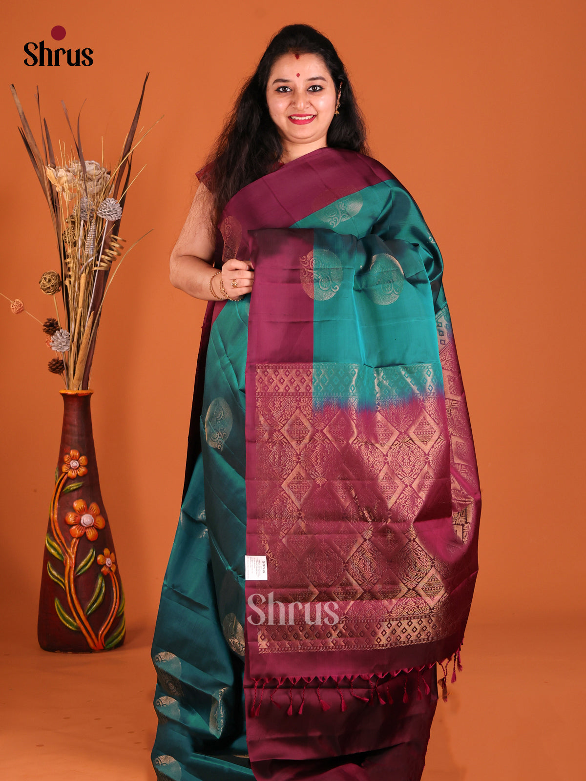 Green & Maroon Softsilk-halfpure Saree with gold zari floral motifs