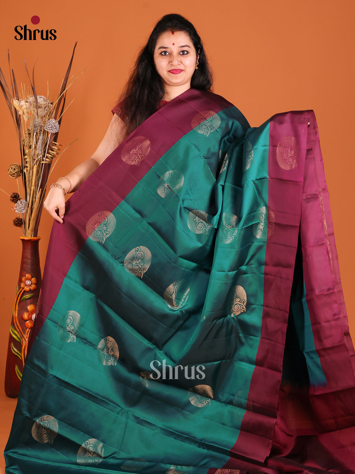 Green & Maroon Softsilk-halfpure Saree with gold zari floral motifs