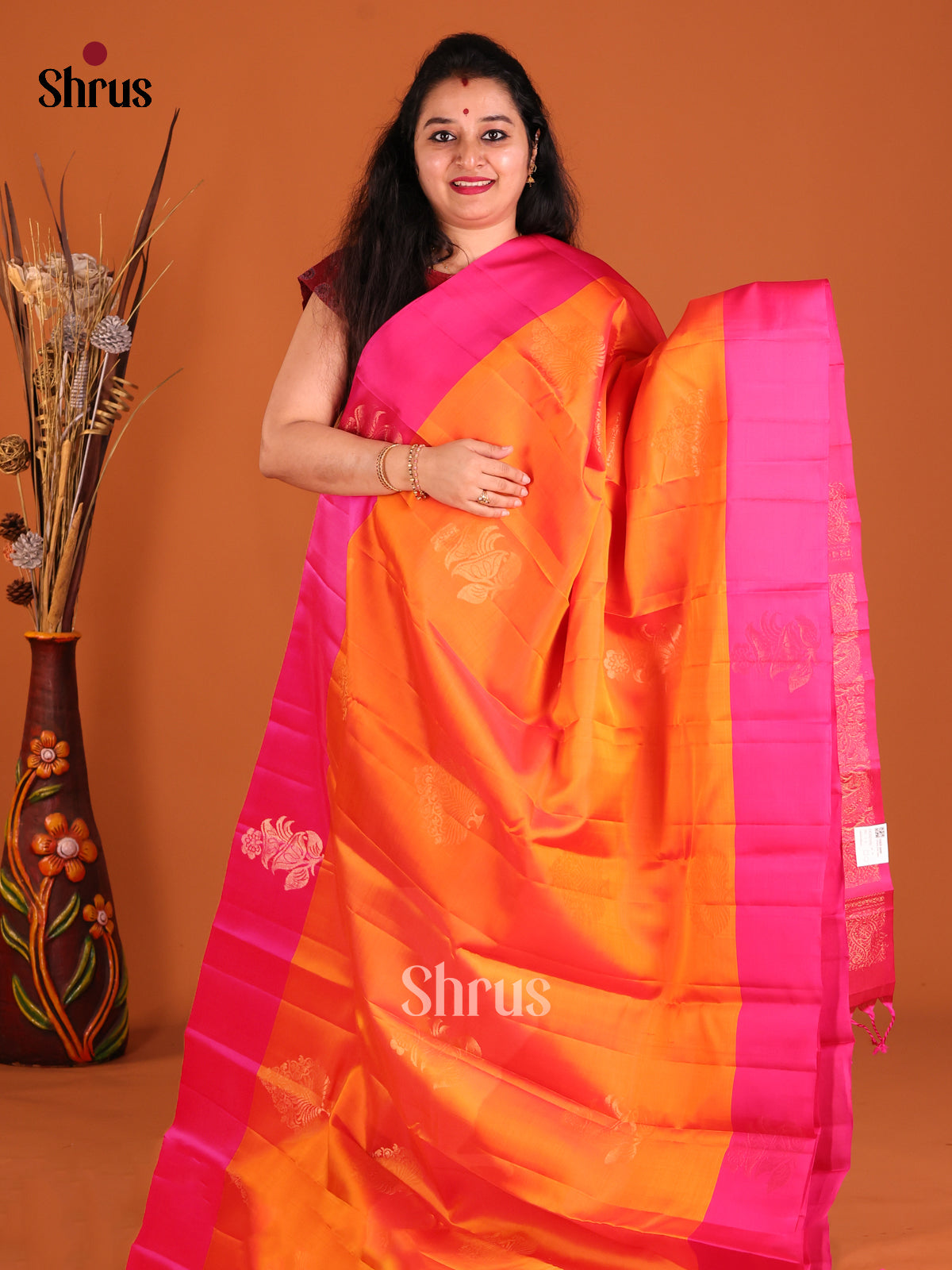Orange & Pink Softsilk-halfpure Saree gleams with gold zari floral motifs
