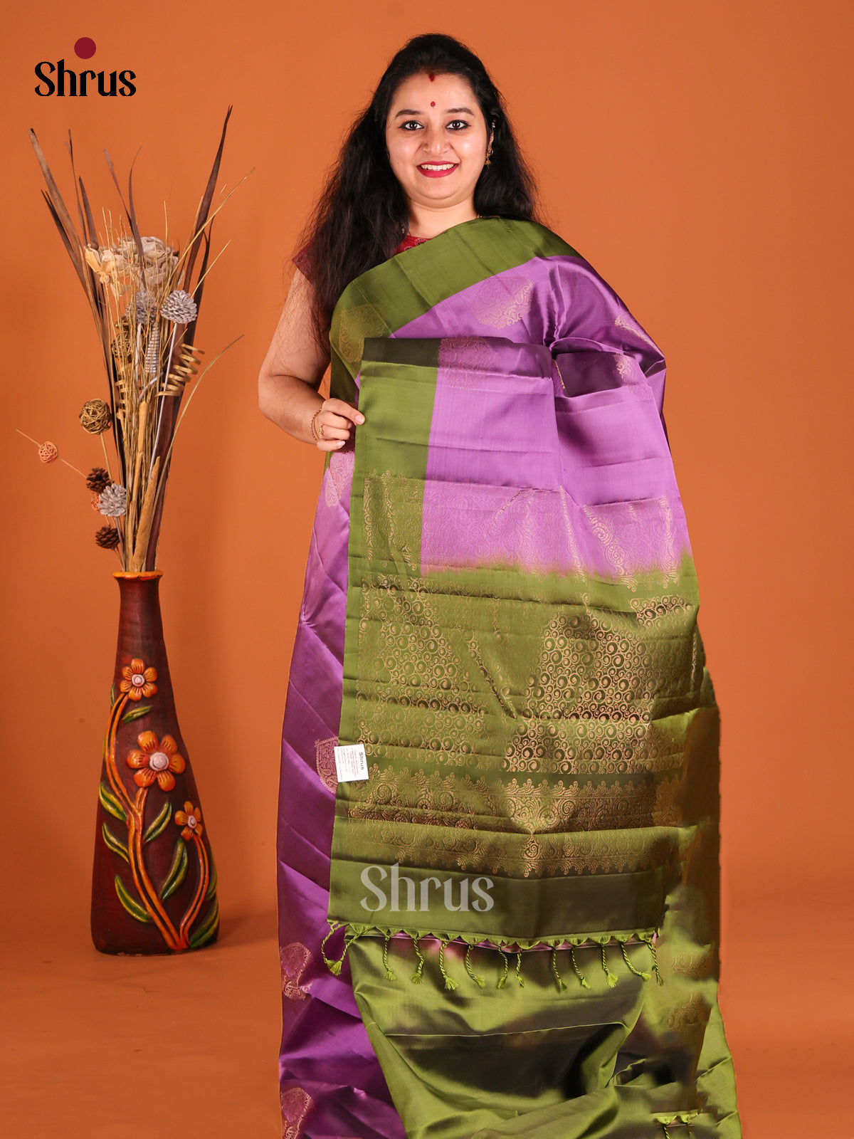 Purple & Green Softsilk-halfpure Saree gleams with zari floral motifs