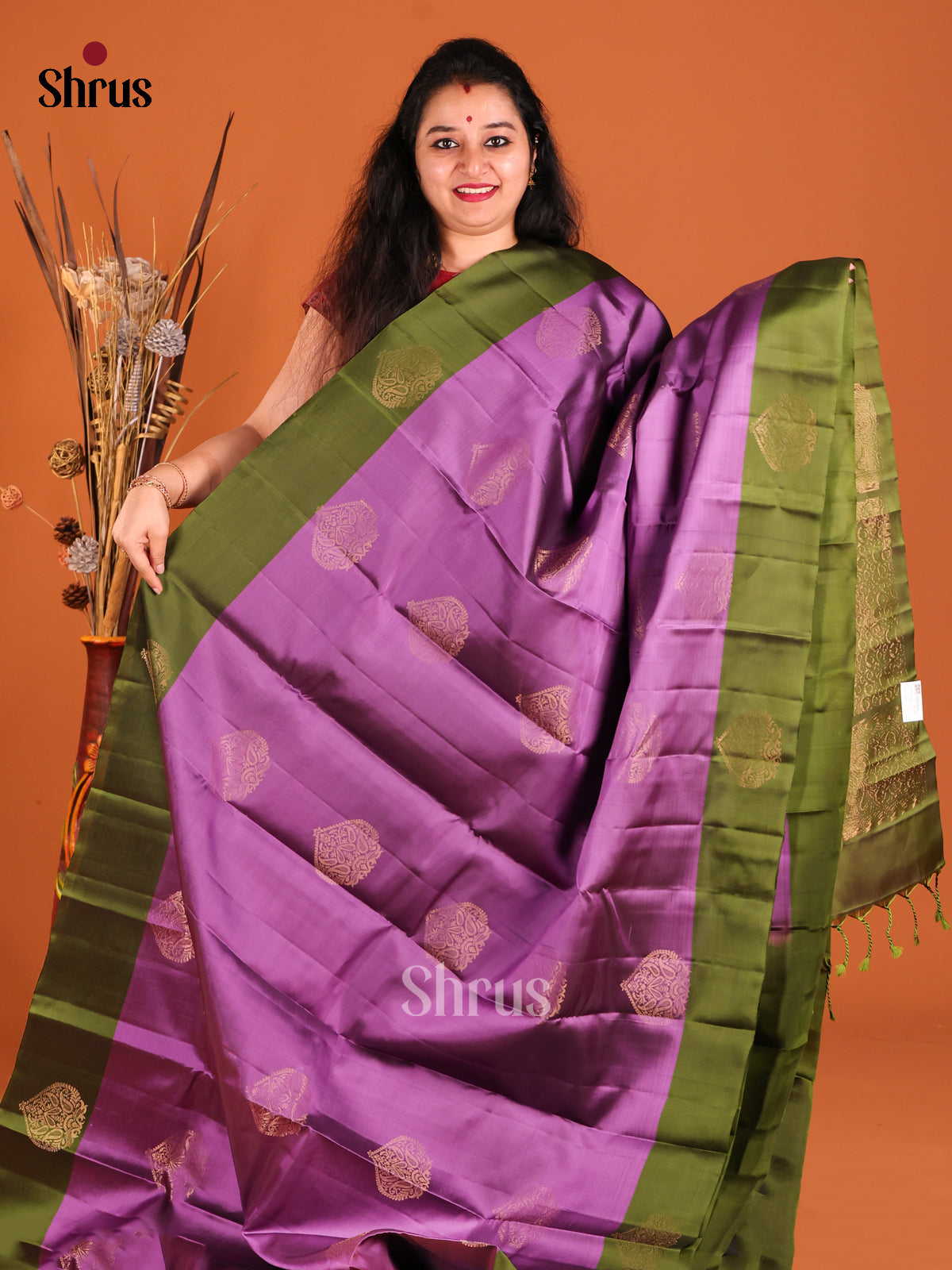 Purple & Green Softsilk-halfpure Saree gleams with zari floral motifs