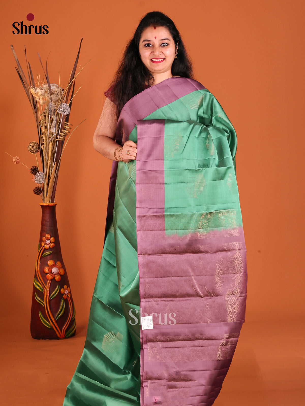 Green & Purple Softsilk-halfpure Saree with zari motifs