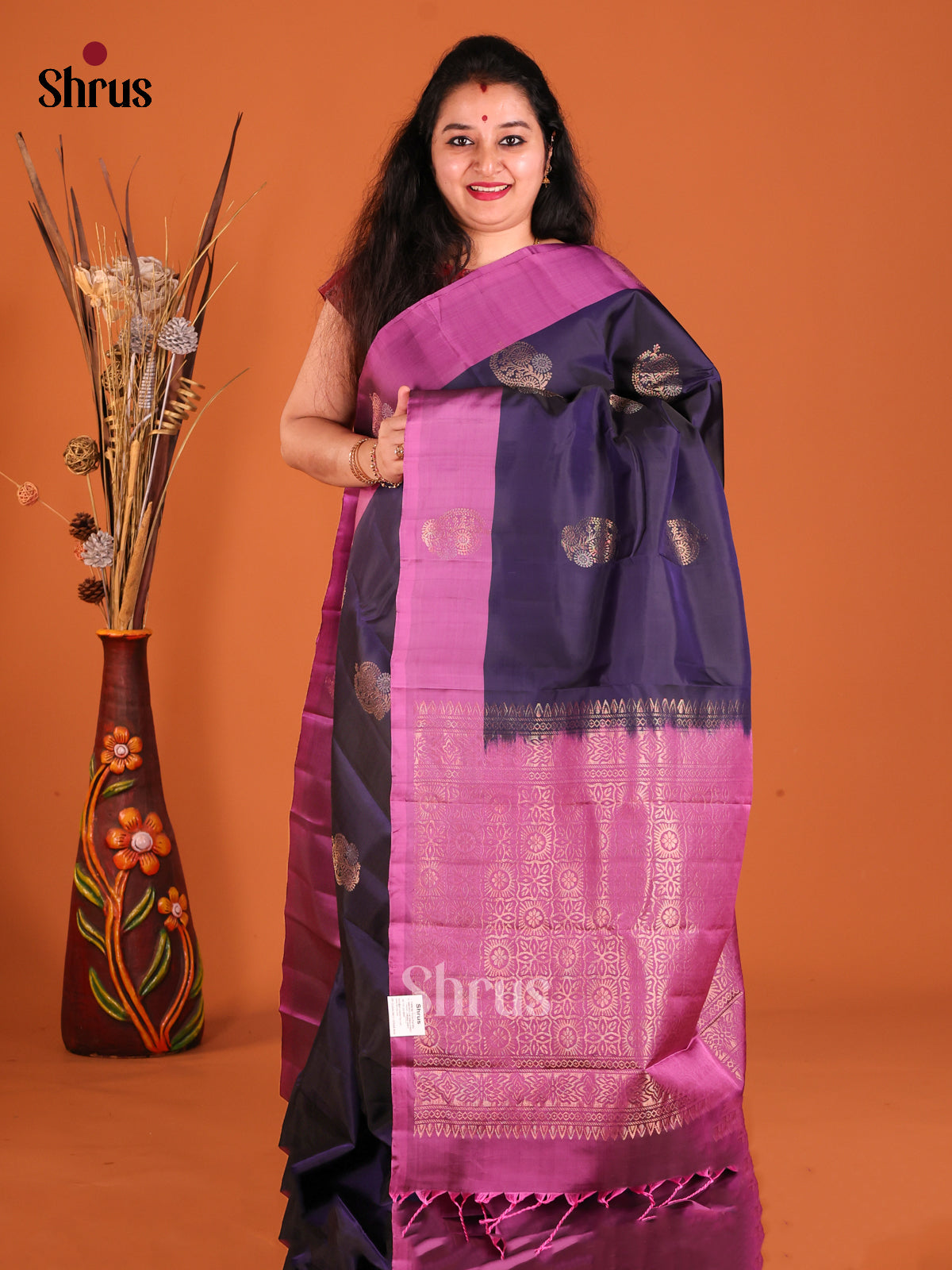 Violet & Purple Softsilk-halfpure Saree gleams with zari floral motifs