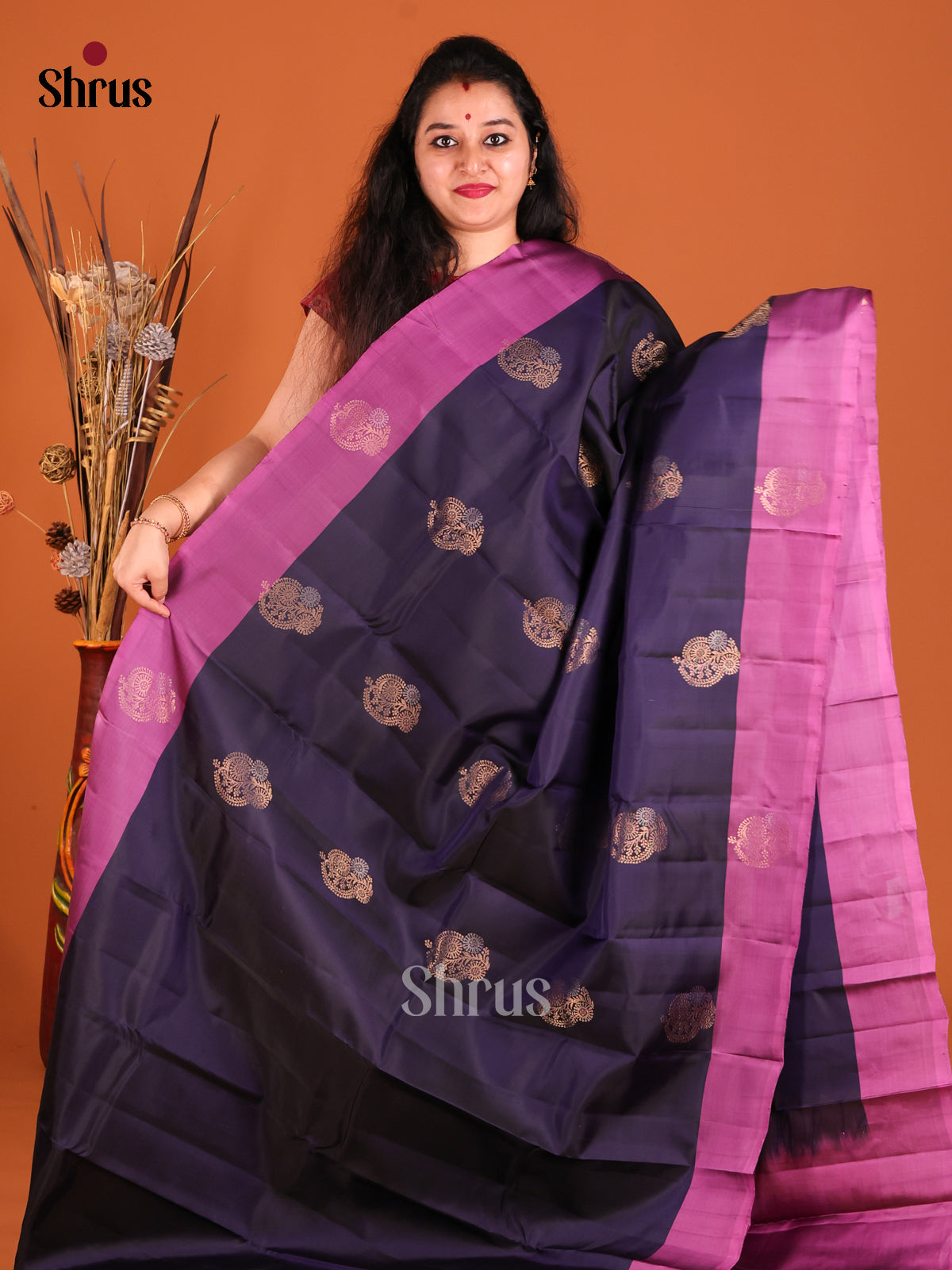 Violet & Purple Softsilk-halfpure Saree gleams with zari floral motifs