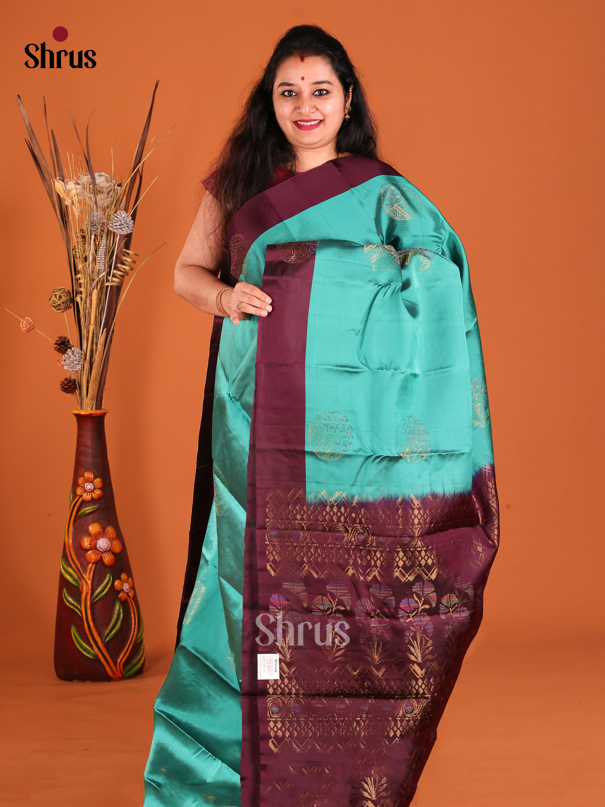 Teal & MAroon Softsilk-halfpure Saree with zari floral motifs