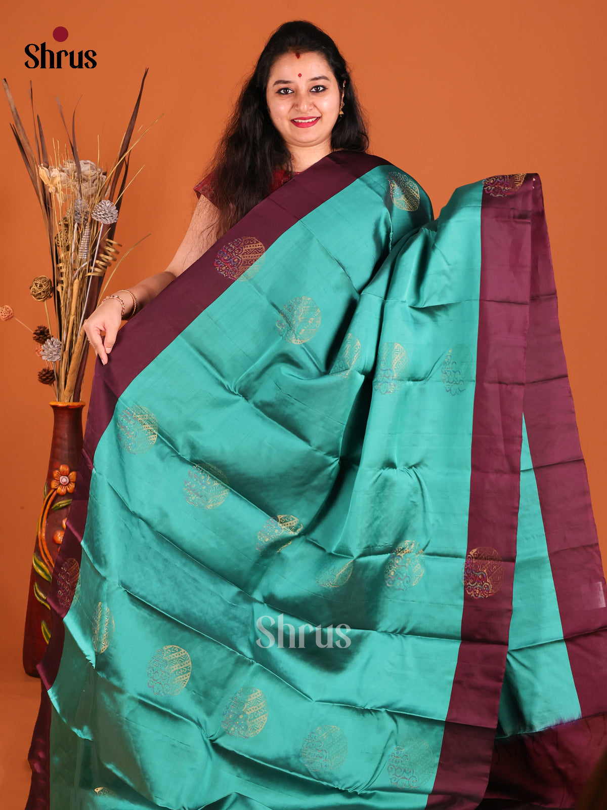 Teal & MAroon Softsilk-halfpure Saree with zari floral motifs