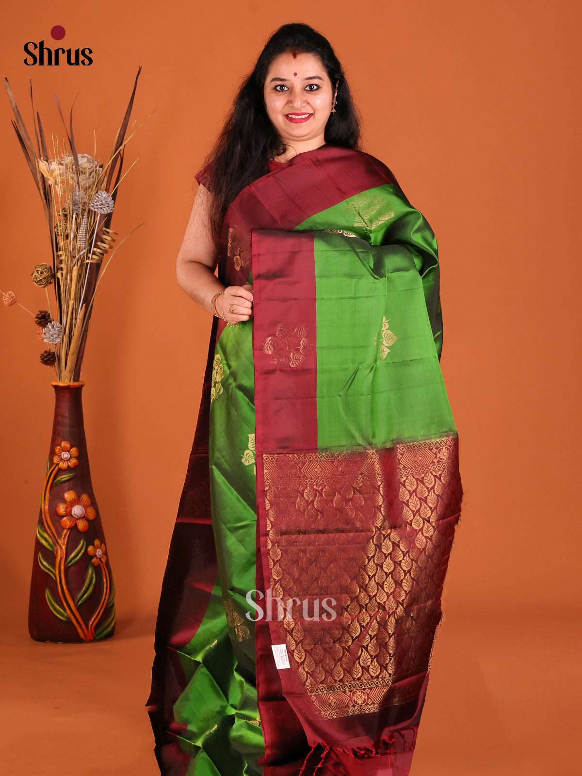 Green & Maroon Softsilk-halfpure Saree with gold zari floral motifs