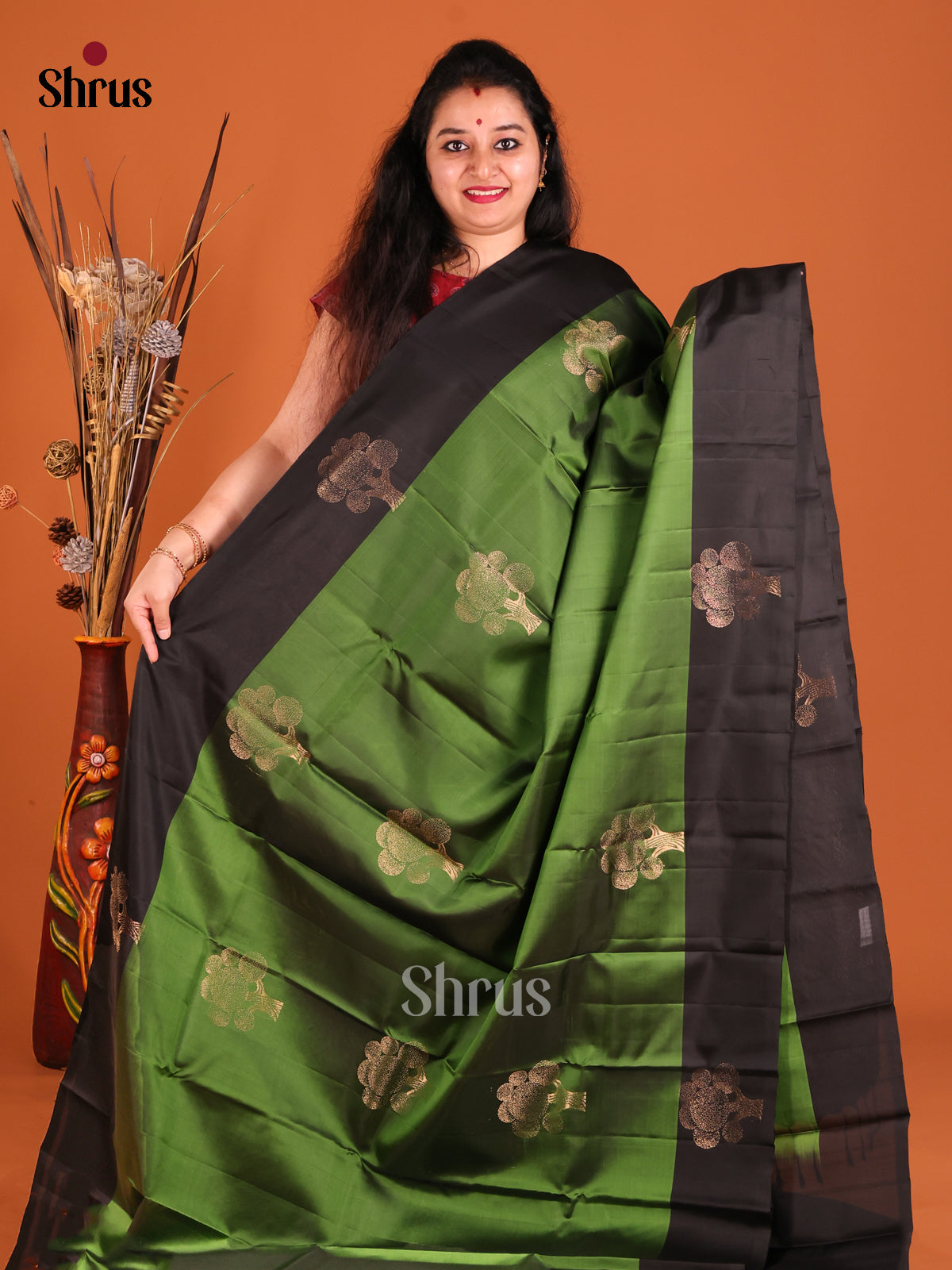 Green & Black Softsilk-halfpure Saree gleams with gold zari floral motifs - Shop on Shrus.com