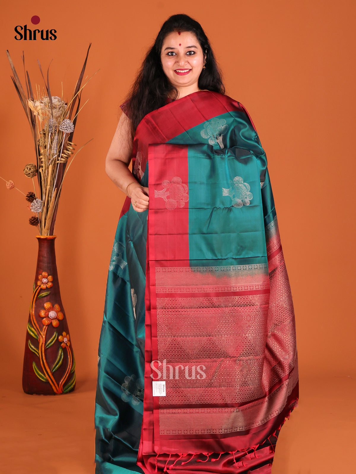 Green & Maroon Softsilk-halfpure Saree gleam with zari floral motifs