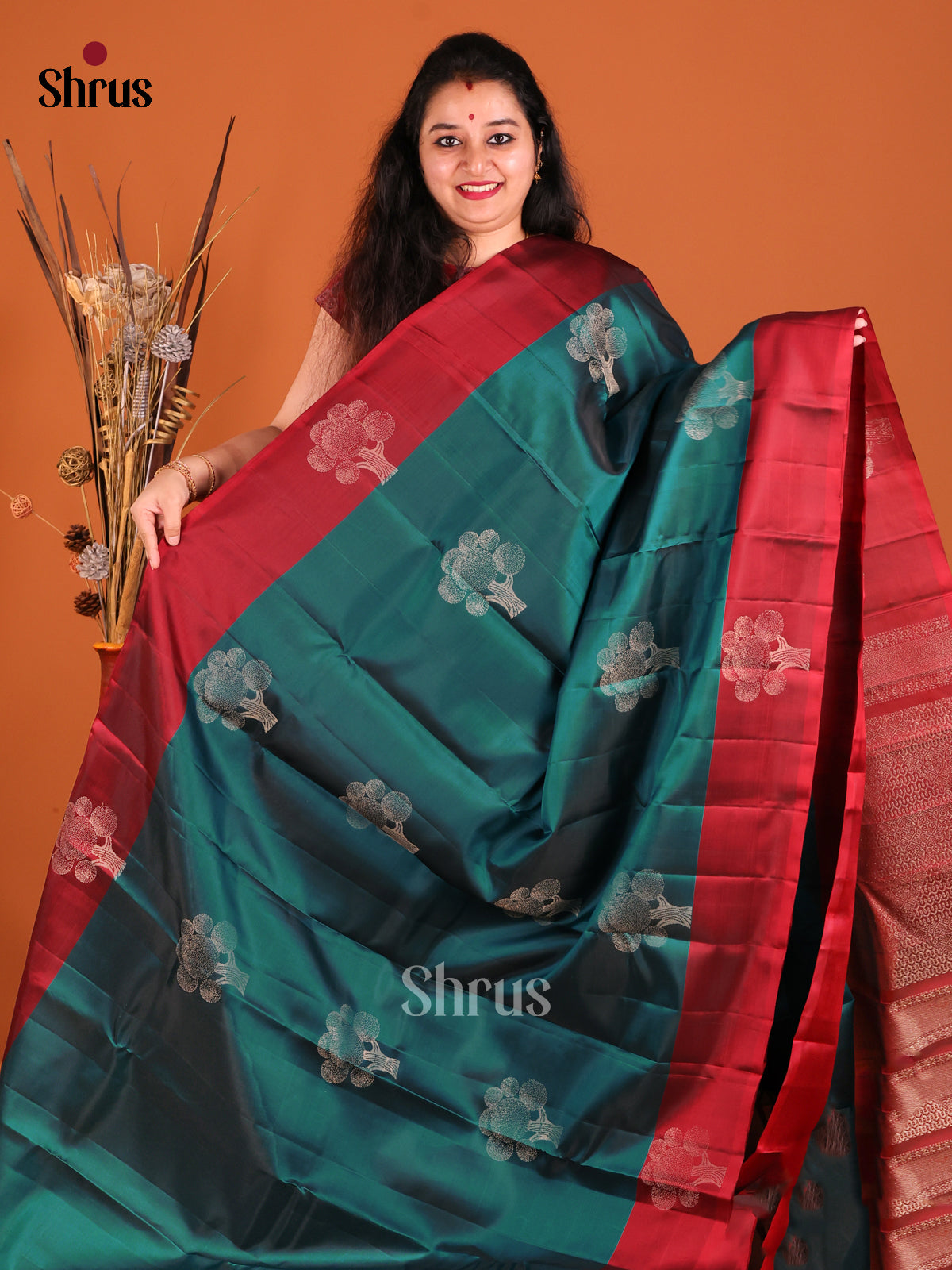 Green & Maroon Softsilk-halfpure Saree gleam with zari floral motifs