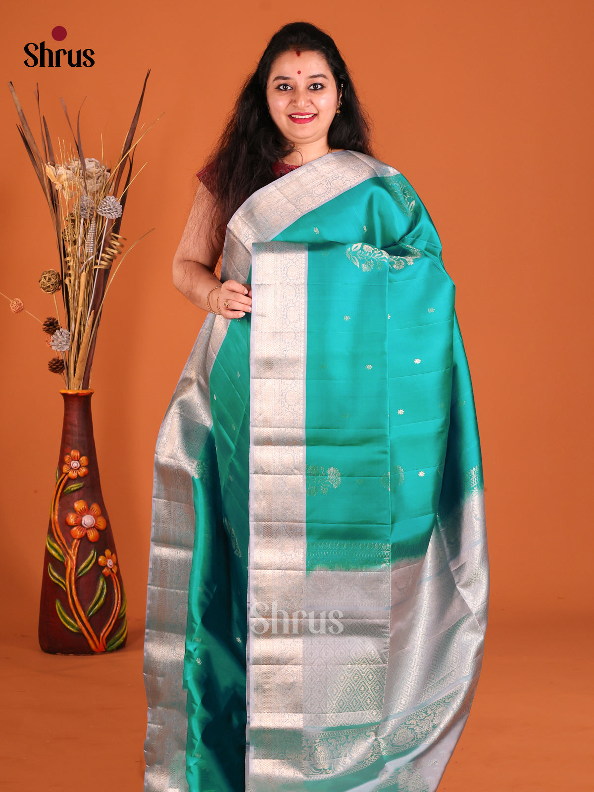 Elegant Green Soft Silk Saree gleams with zari floral buttas-1