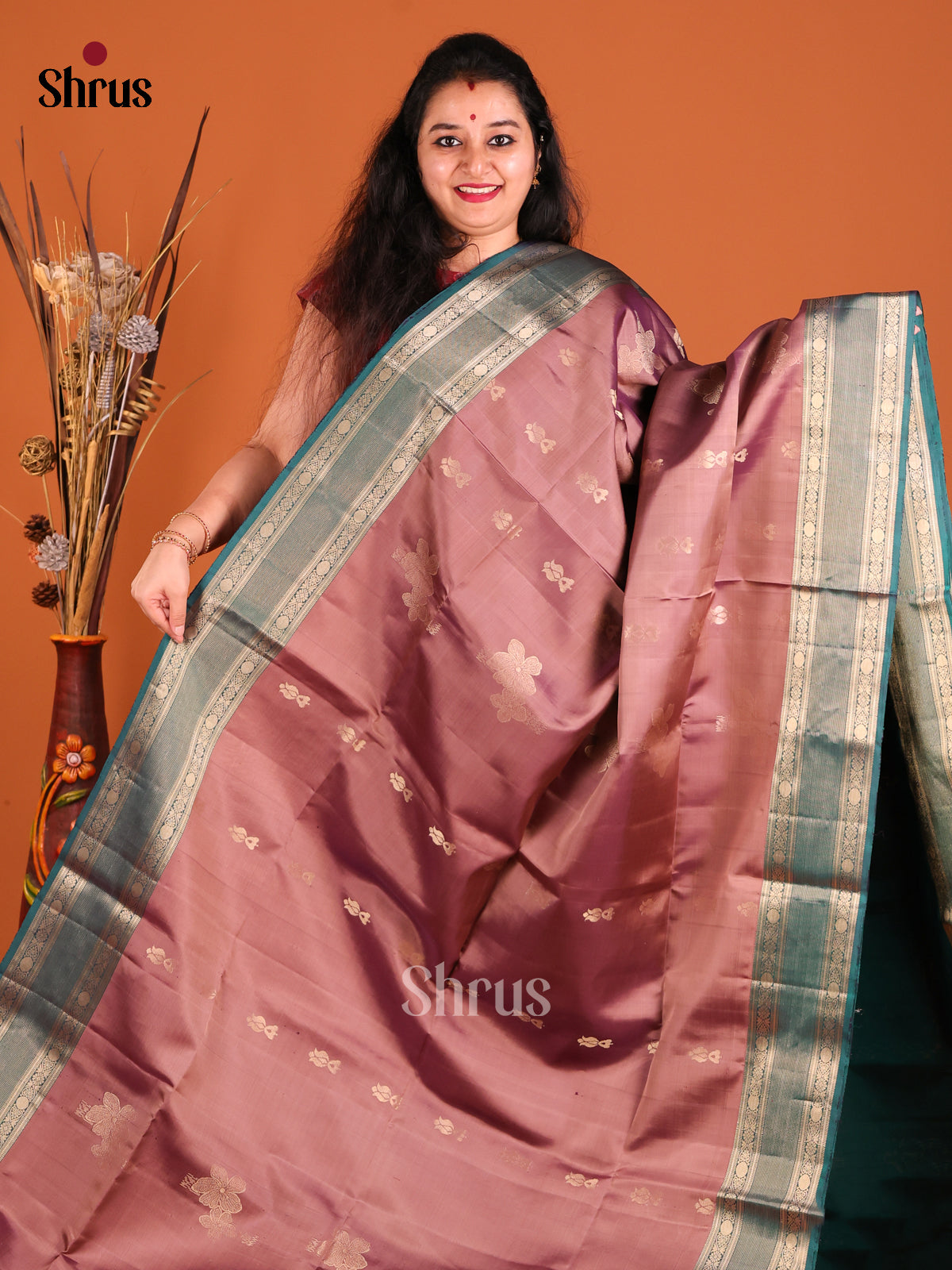 Onion Peel & Peacock Green Soft Silk Saree gleams with gold zari buttas