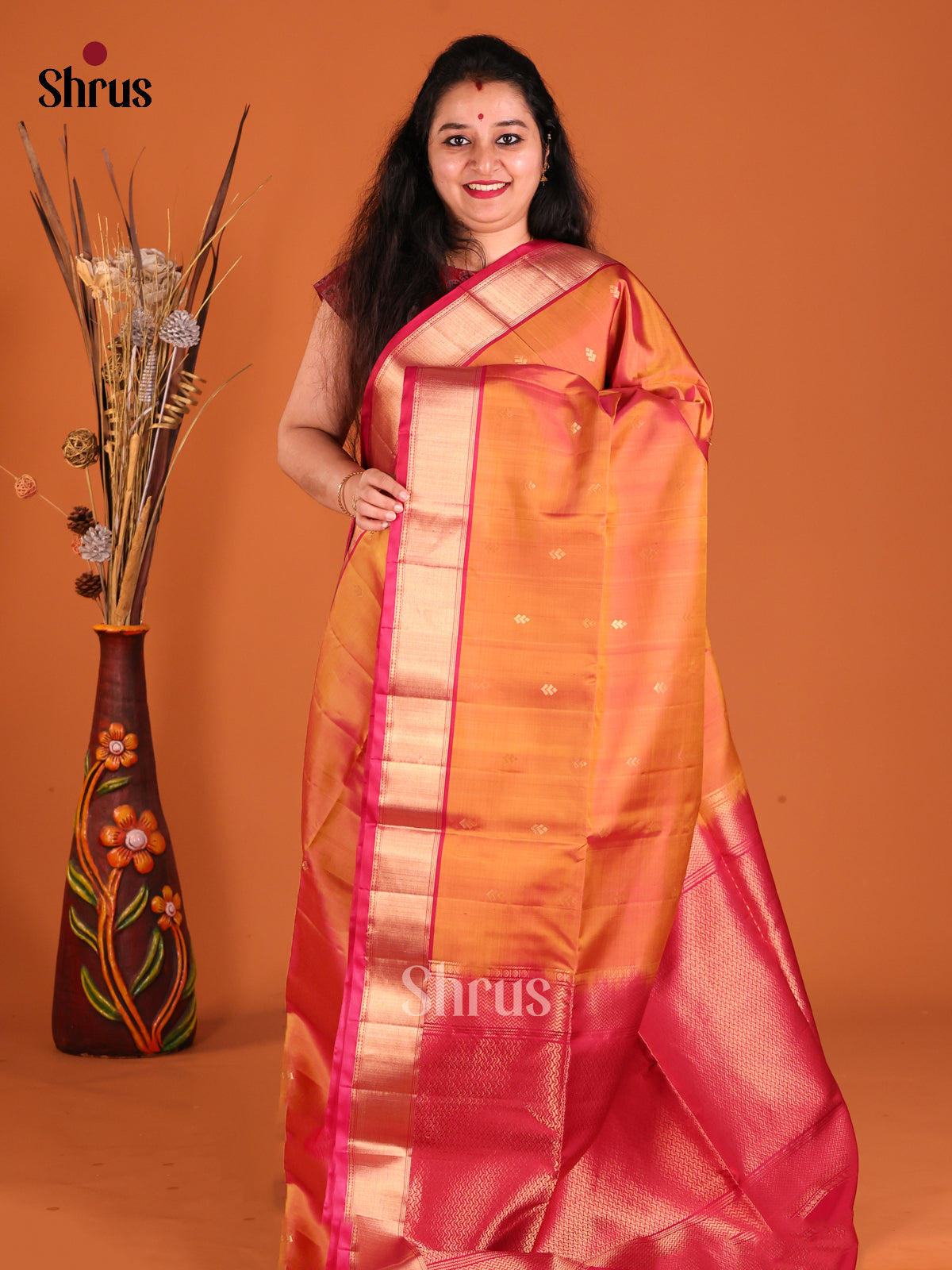 Radiant Orange Soft Silk Saree with rich traditional zari border