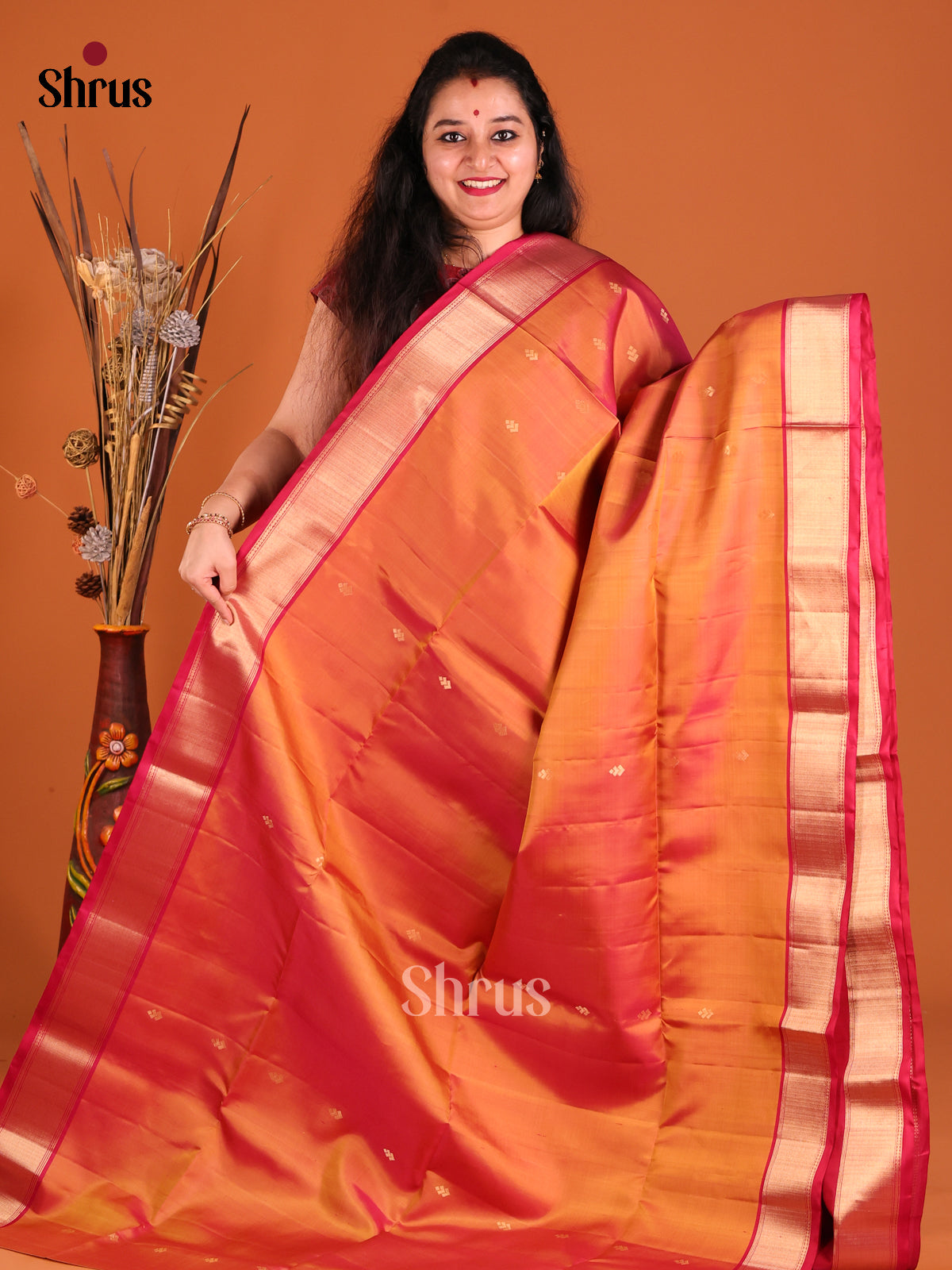 Radiant Orange Soft Silk Saree with rich traditional zari border