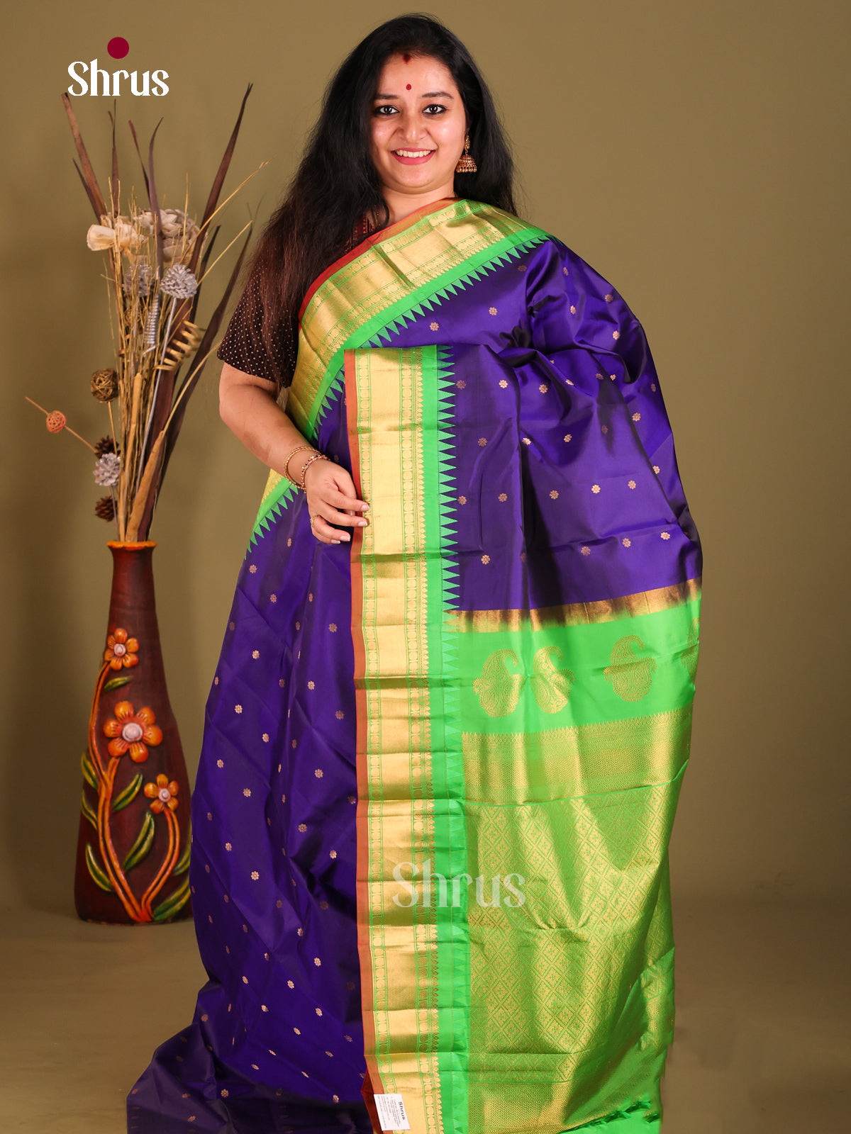 Graceful Blue Gadwal silk Saree with Golden Buttas & Green zari brocade pallu