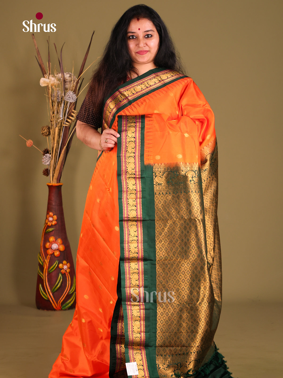 Rediant Orange Gadwal silk Saree with Zari Buttas & rich Green traditional zari border