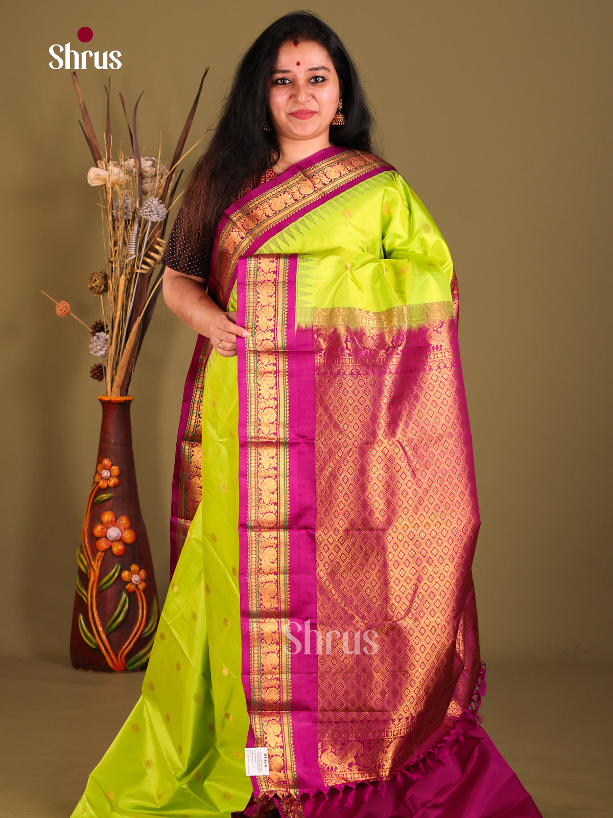 Regal Light Green Gadwal silk Saree with Peacock buttas in Purple Border