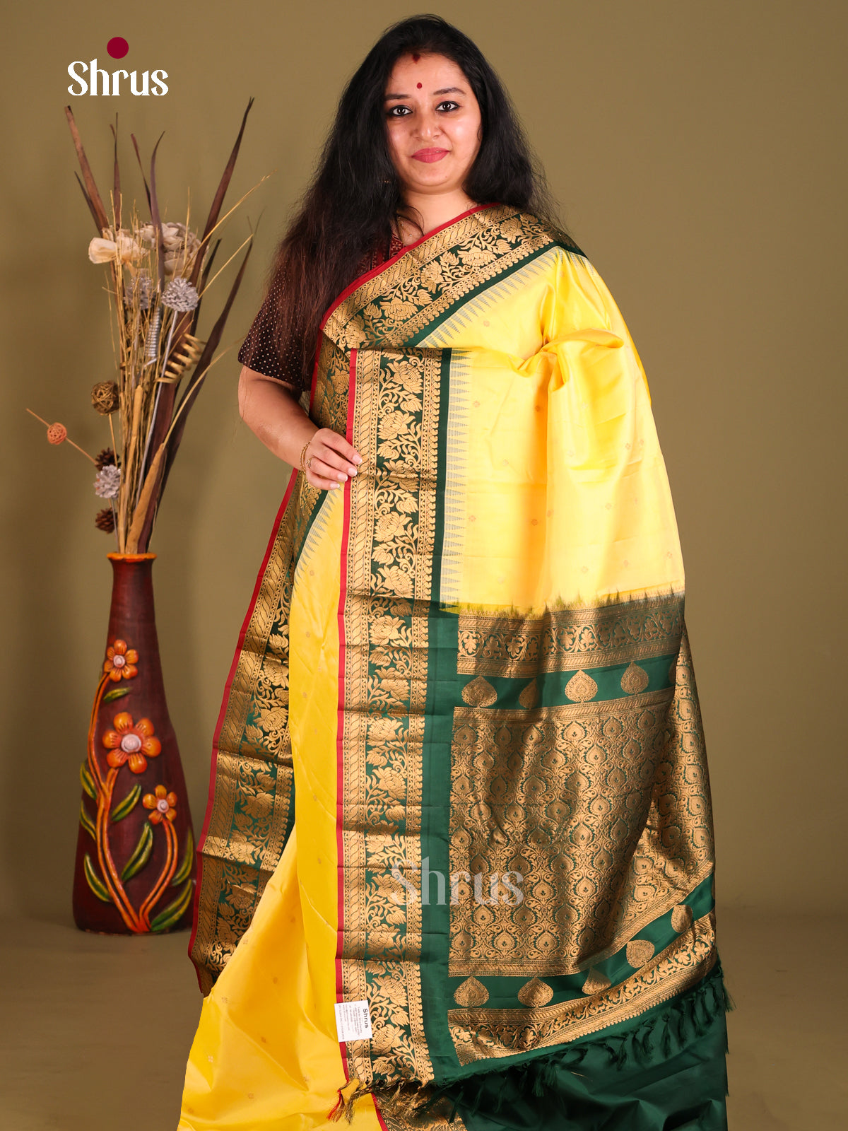 Luminous Yellow Gadwal silk Saree with Zari Buttas & Green Border