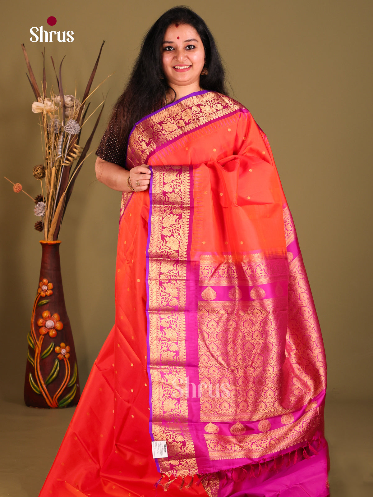 Vibrant Orange Gadwal silk Saree with gold zari buttas & Purple Brocade Pallu