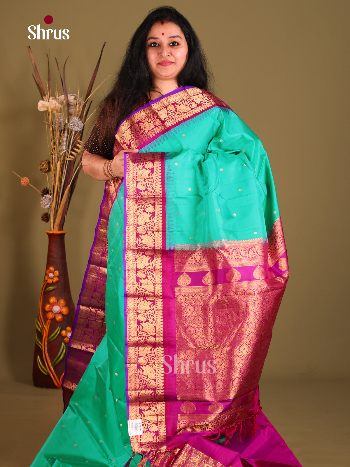 Serene Green Gadwal silk Saree with Golden Buttas & Magenta floral vines border