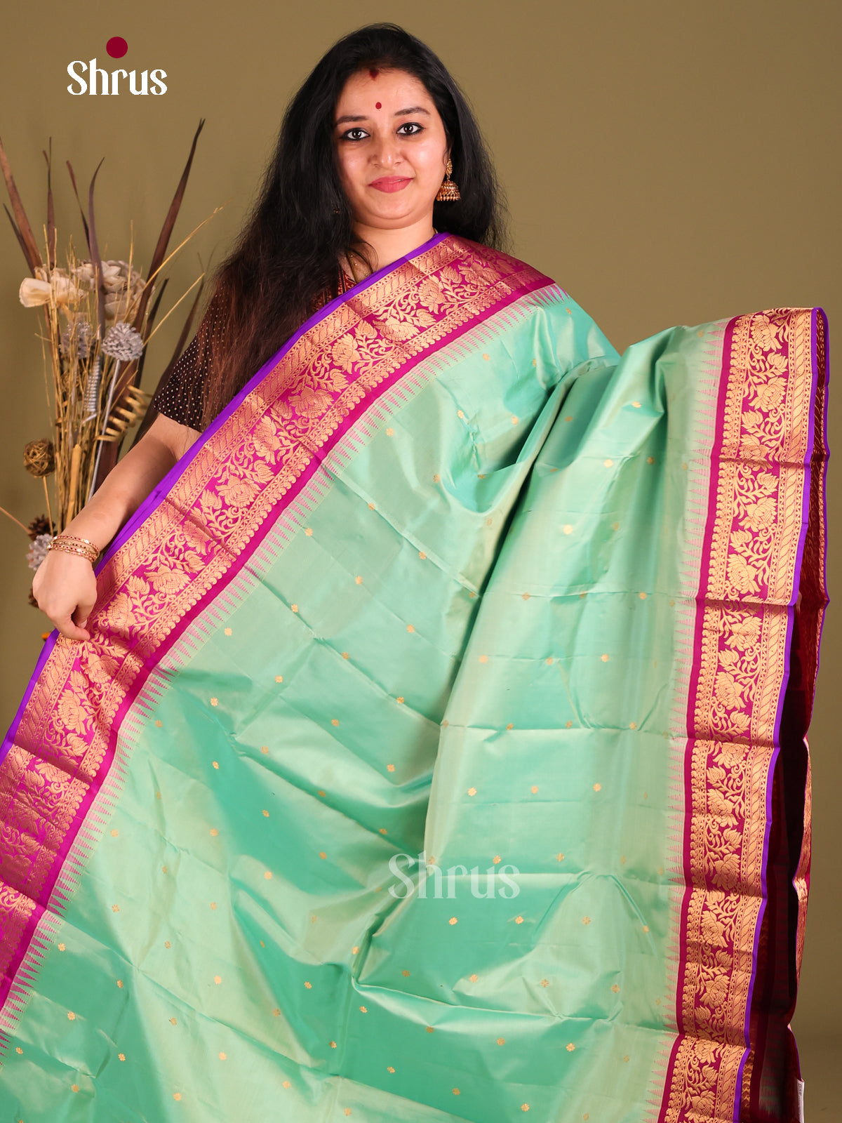 Elegant Teal Green Gadwal silk Saree with Magenta floral vines zari border-1