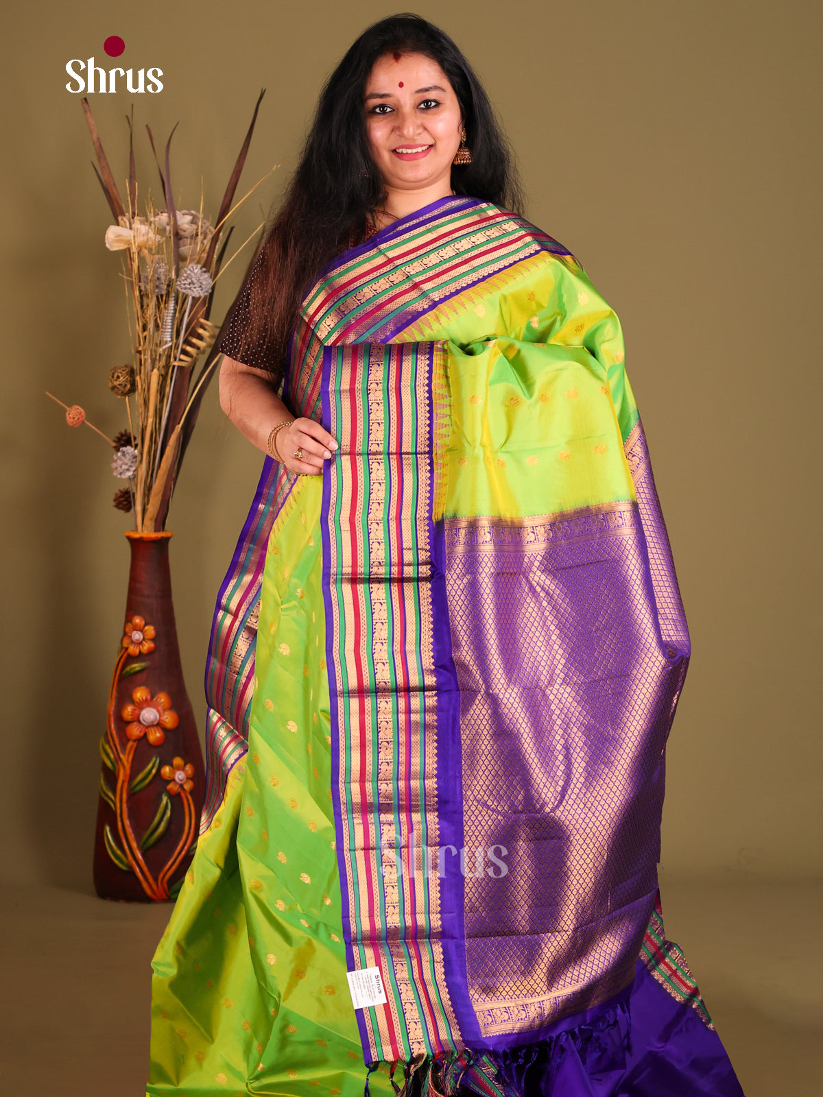 Lush Parrot green Gadwal silk Saree with peacock zari buttas & Blue Brocade Pallu