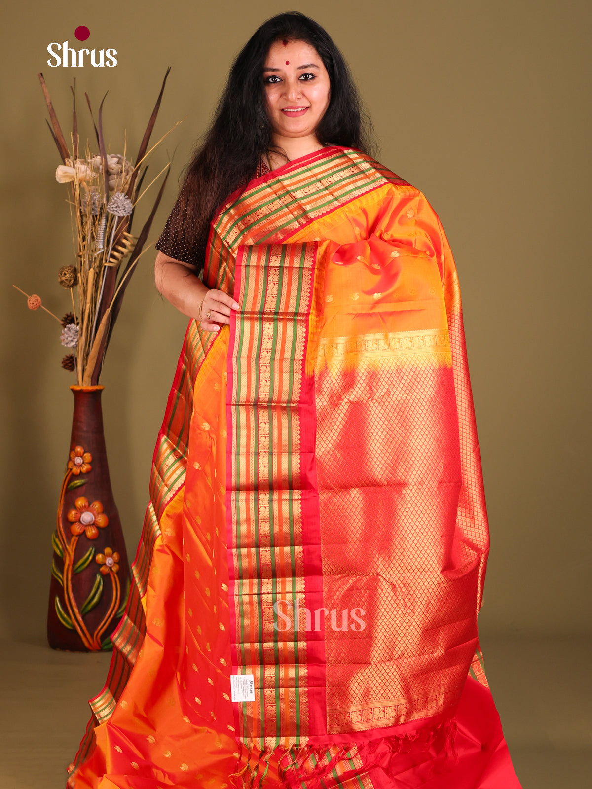 Radiant Orange Gadwal silk Saree with peacock zari buttas & Red Brocade Pallu