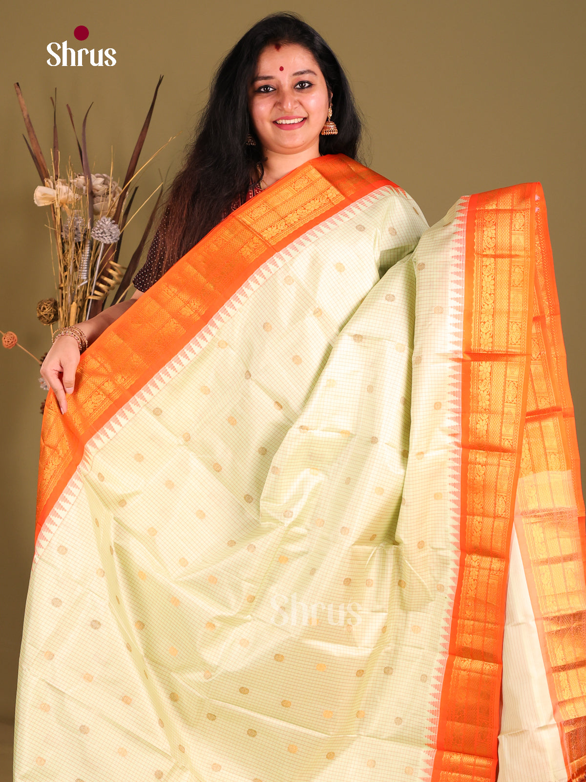 Subtle Cream Gadwal silk Saree with intricate checks, floral buttas & Orange Zari Border-1