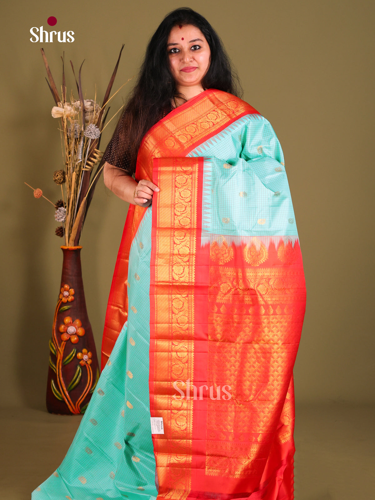Exquisite Teal Blue Gadwal silk Saree with Gold Buttas & Rich Zari Border in Red