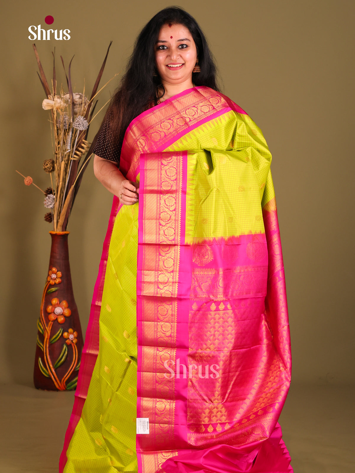 Luminous Light Green Gadwal silk Saree with Zari Kattam, Golden Buttas & Pink border