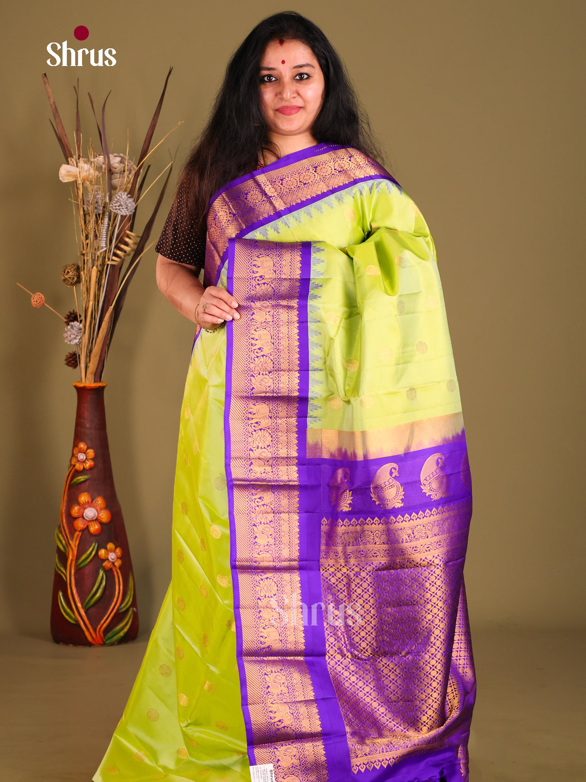 Regal Light Green Gadwal silk Saree with ZAri Floral Buttas & rich Violet border