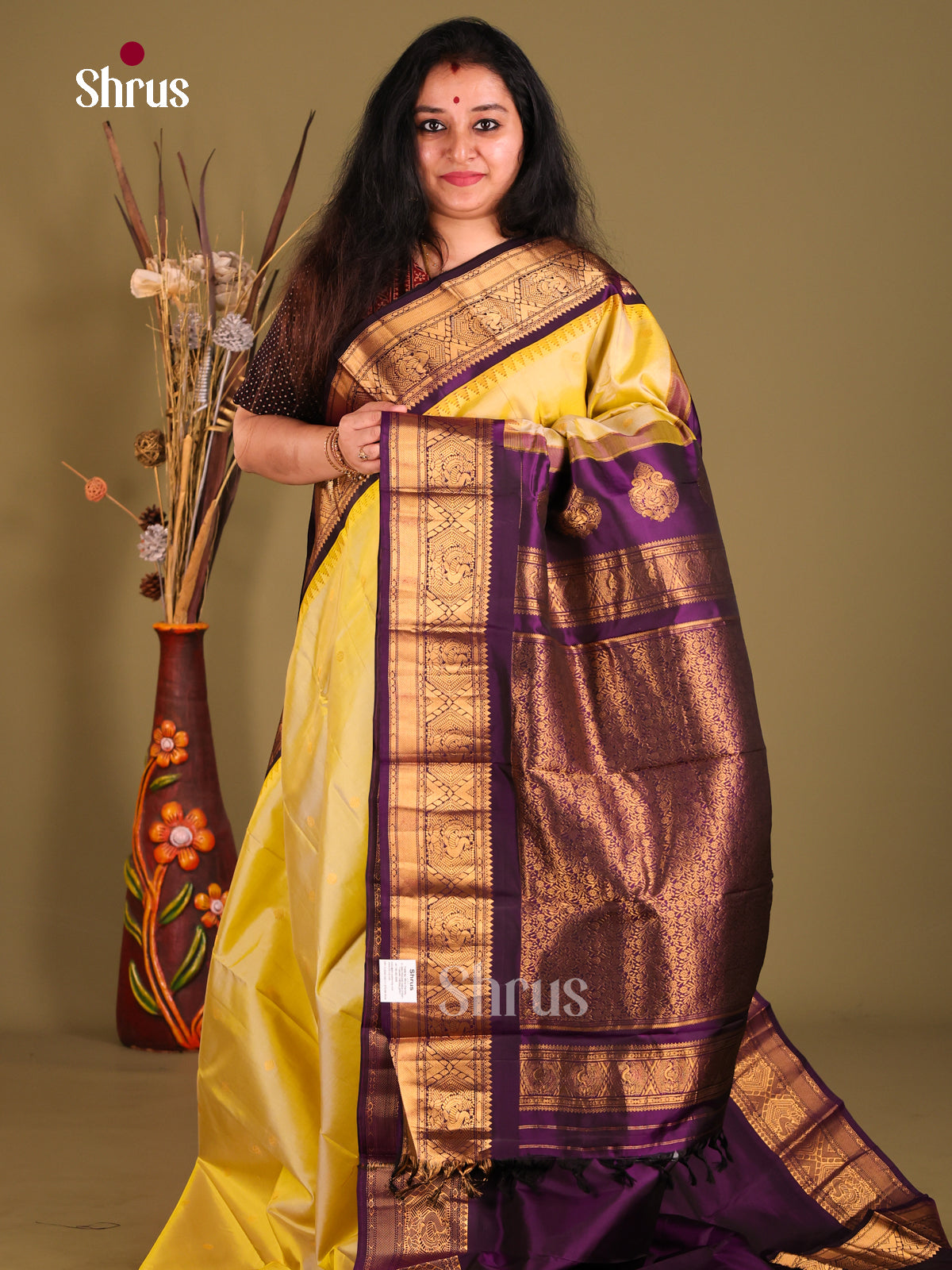 Glamorous Yellow Gadwal silk Saree with Floral Buttas & Violet zari border - Shop on Shrus.com